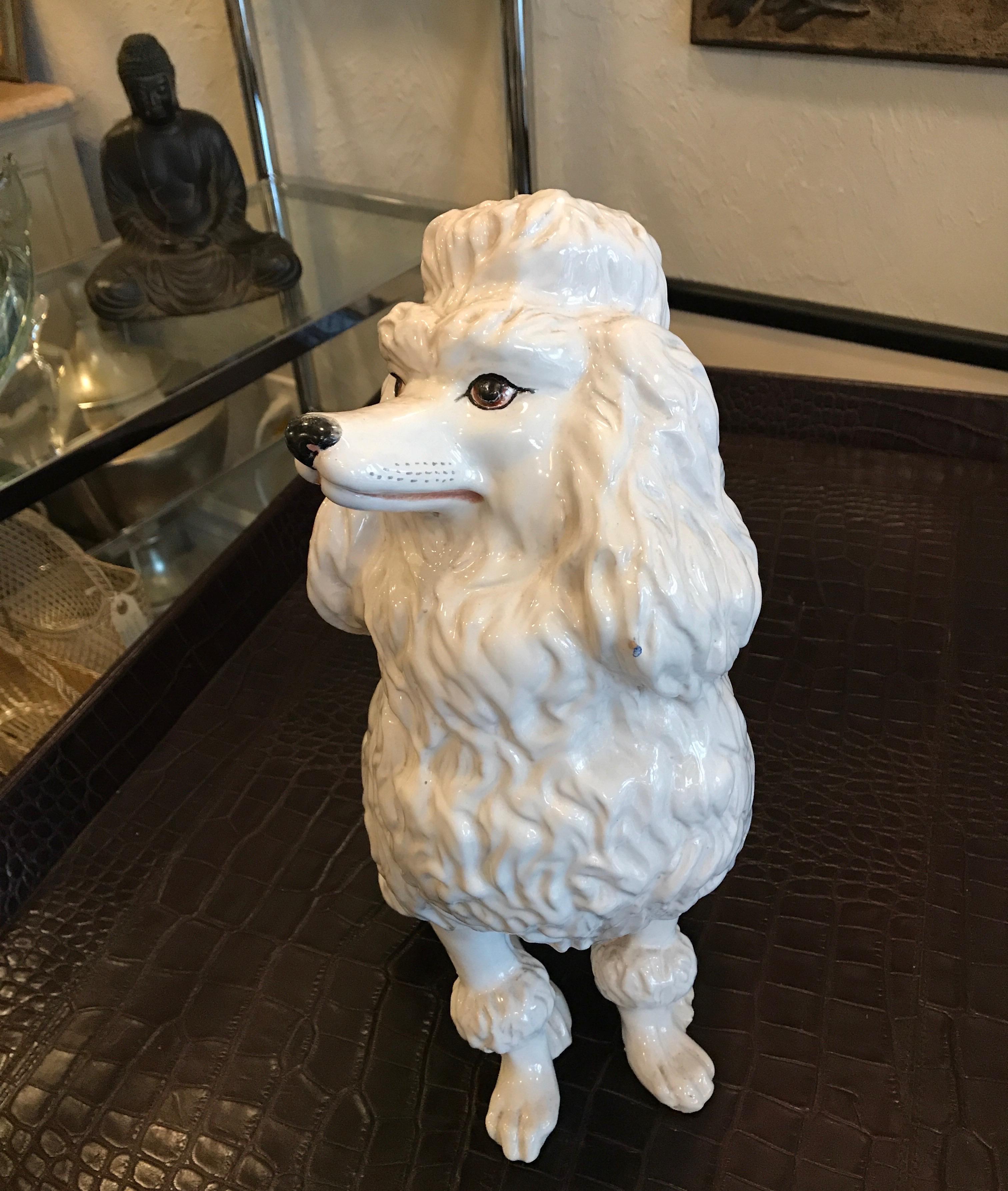 Vintage Italian white glazed terracotta seated French poodle.