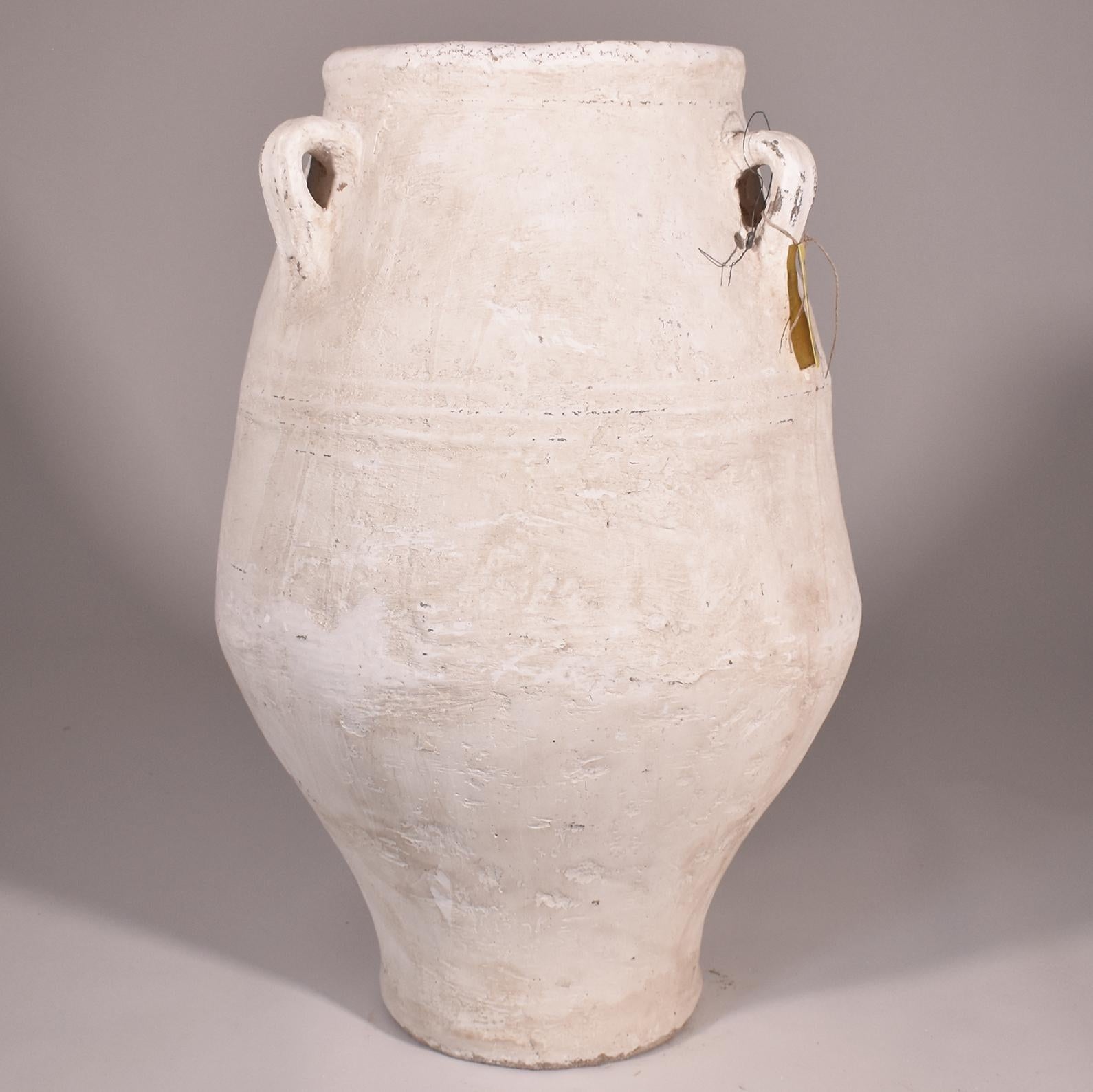 Large three-handled terracotta Jardiniere or Planter with white finish and gentle shape. I find these scattered across the elegant exteriors of homes in Southern France and Italy and use them in my own yard in New Orleans. The graceful Silhouette