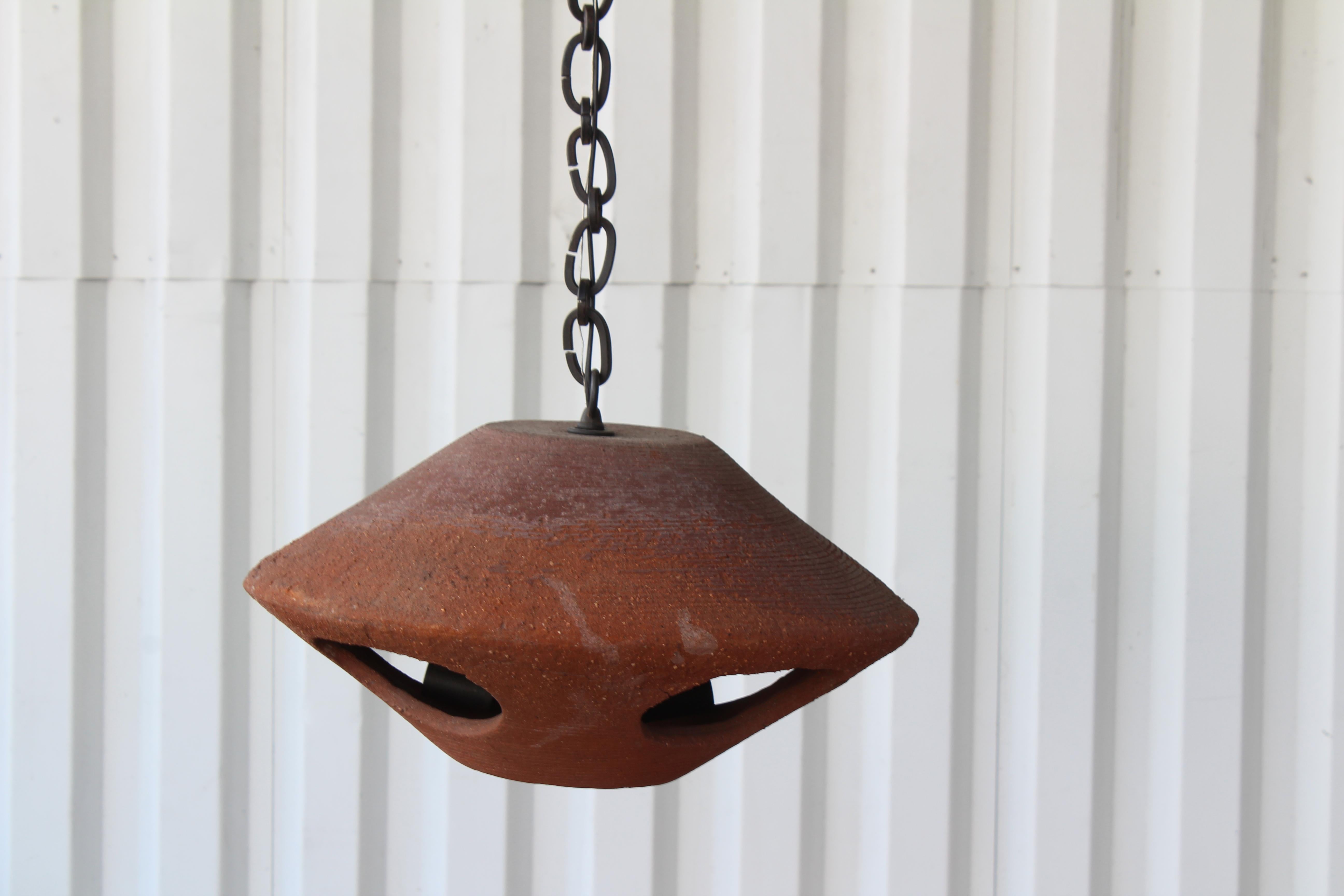 Vintage terra-cotta pendant light, California, 1960s. Custom rewired and fitted with an iron chain. Total length from canopy to the bottom of the pendant is 59