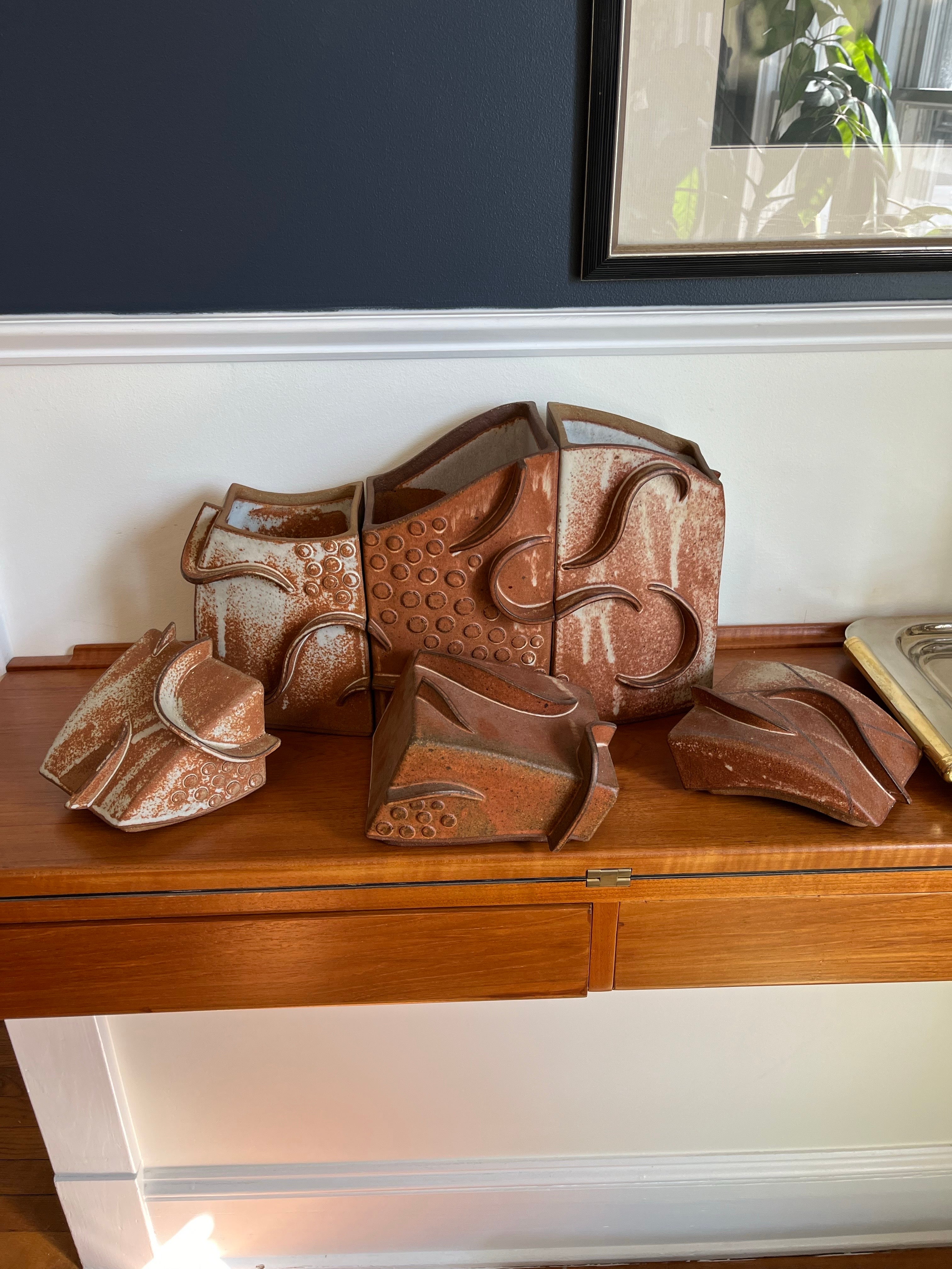unique organic modern terra cotta 3 piece canister set. Nautical octopus styling in rich tones. Great visual appeal. 