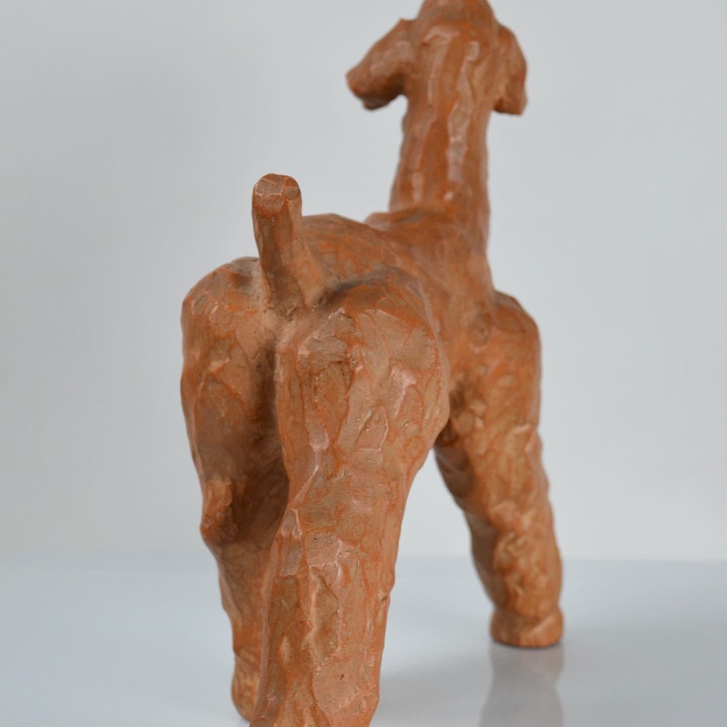Terracotta dog sculpture 
Signed POL under the piece
25x27 cm