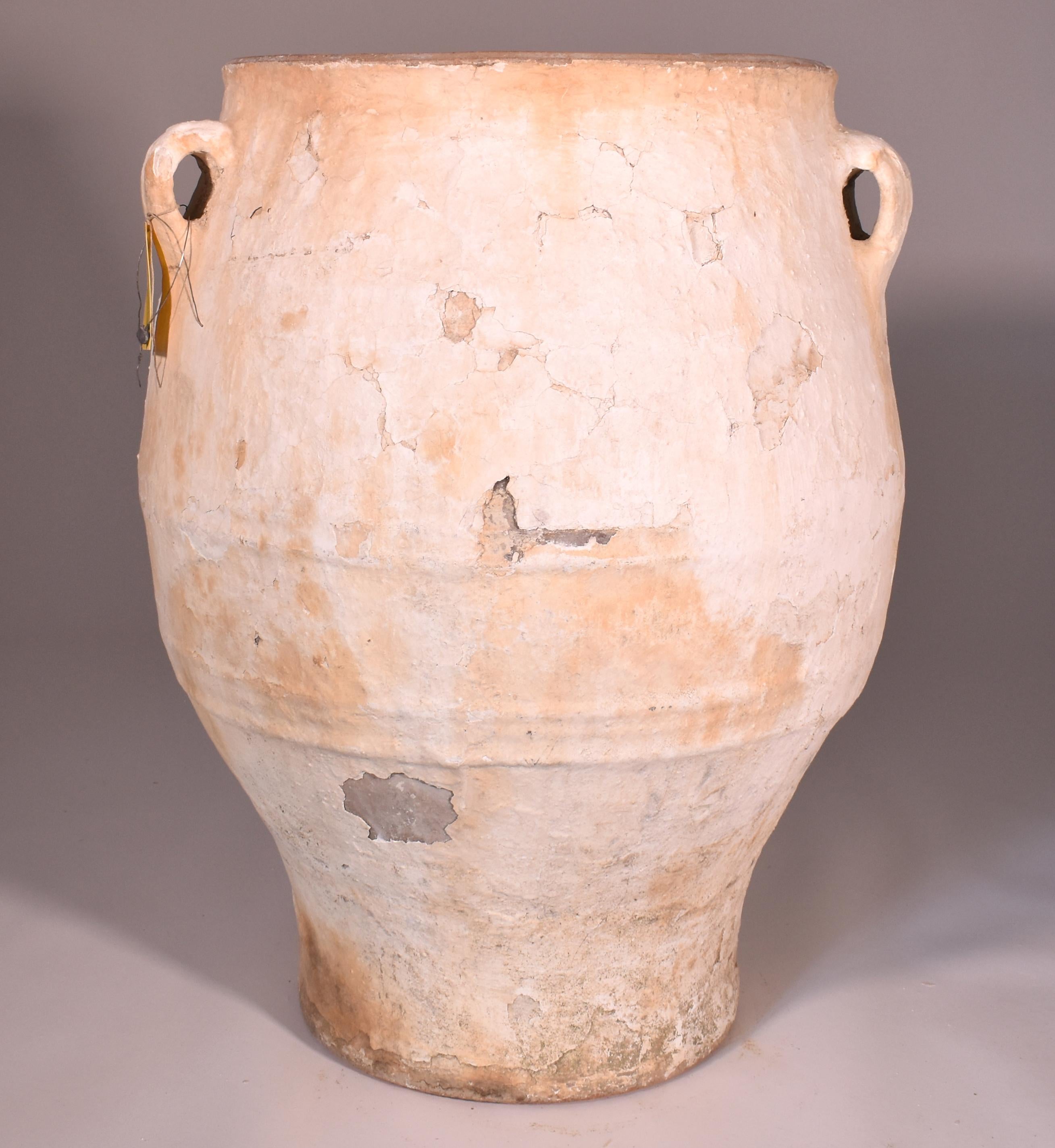 Large three-handled terracotta Jardiniere or Planter with white finish and gentle shape. I find these scattered across the elegant exteriors of homes in Southern France and Italy and use them in my own yard in New Orleans. The graceful silhouette