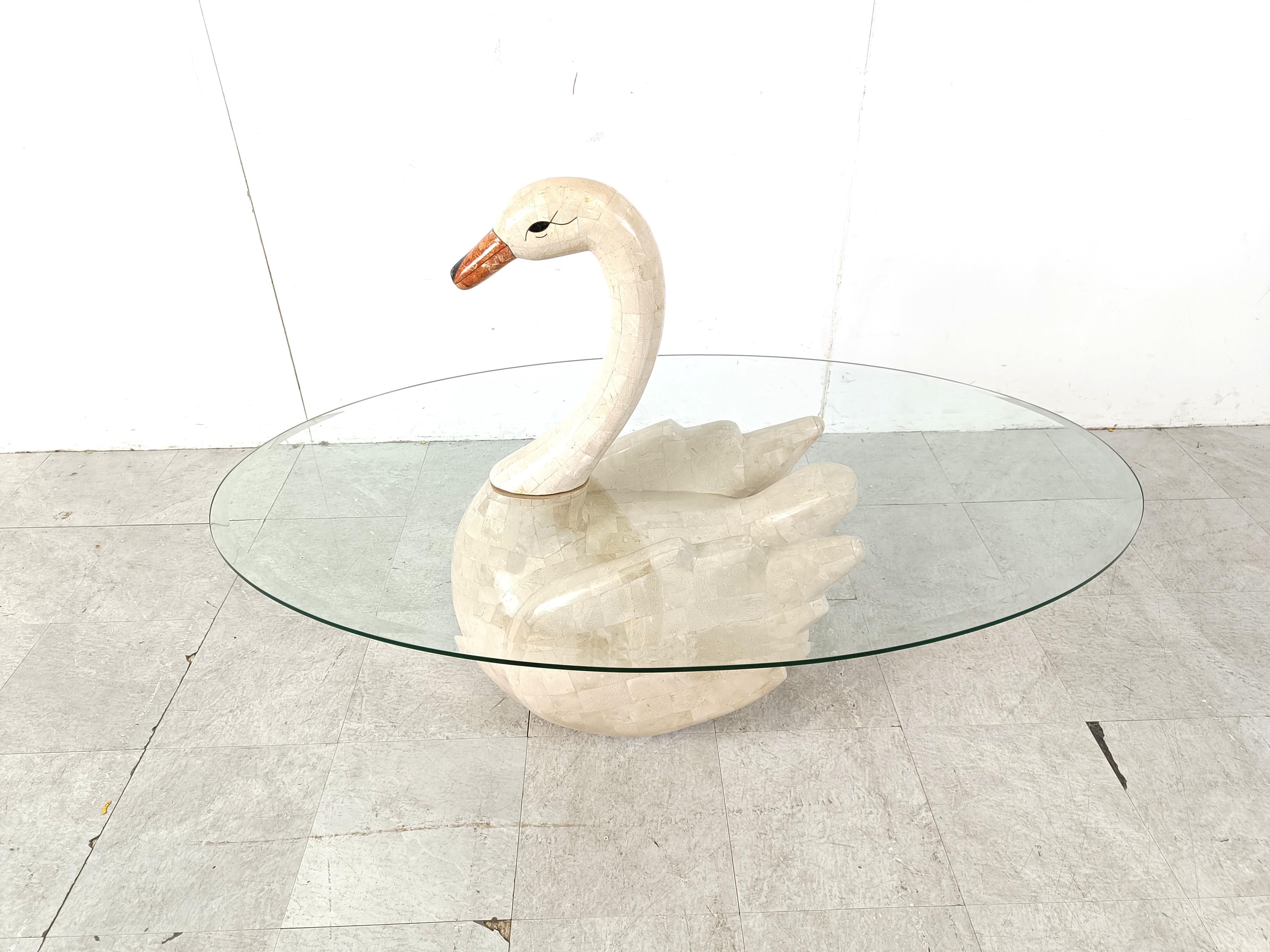 Unique vintage tesselated stone coffee table depicting a swan.

Clear oval beveled glass top.

Gorgeous and very elegant coffee table, a real eye catcher.

1980s - Asia

Dimensions
Height: 88cm
Width: 135cm
Depth: 80cm

Ref.: 543544