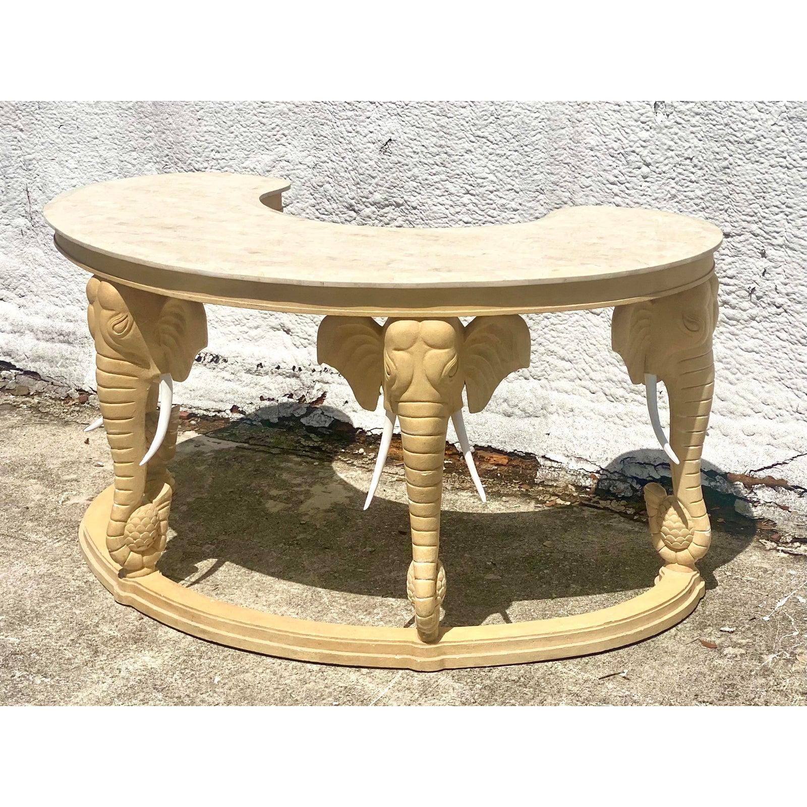 Vintage Regency writing desk and chair. Beautiful curved top with a tessellated stone surface. Striking matching chairs. All tusks intact. Acquired from a Palm Beach estate.