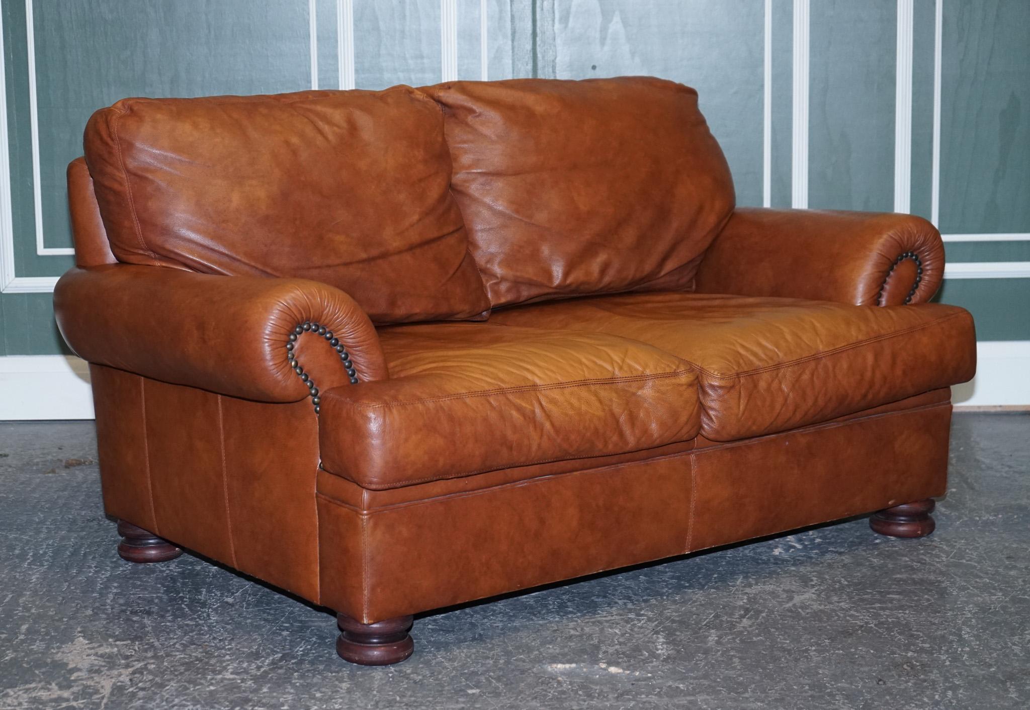 We are delighted to present this stunning Tetrad Tan leather Cordoba 2-seater sofa.

We have sold this model plenty of times in the past and are always really happy with the quality. Retailed by John Lewis.

The cushions are still very plum and