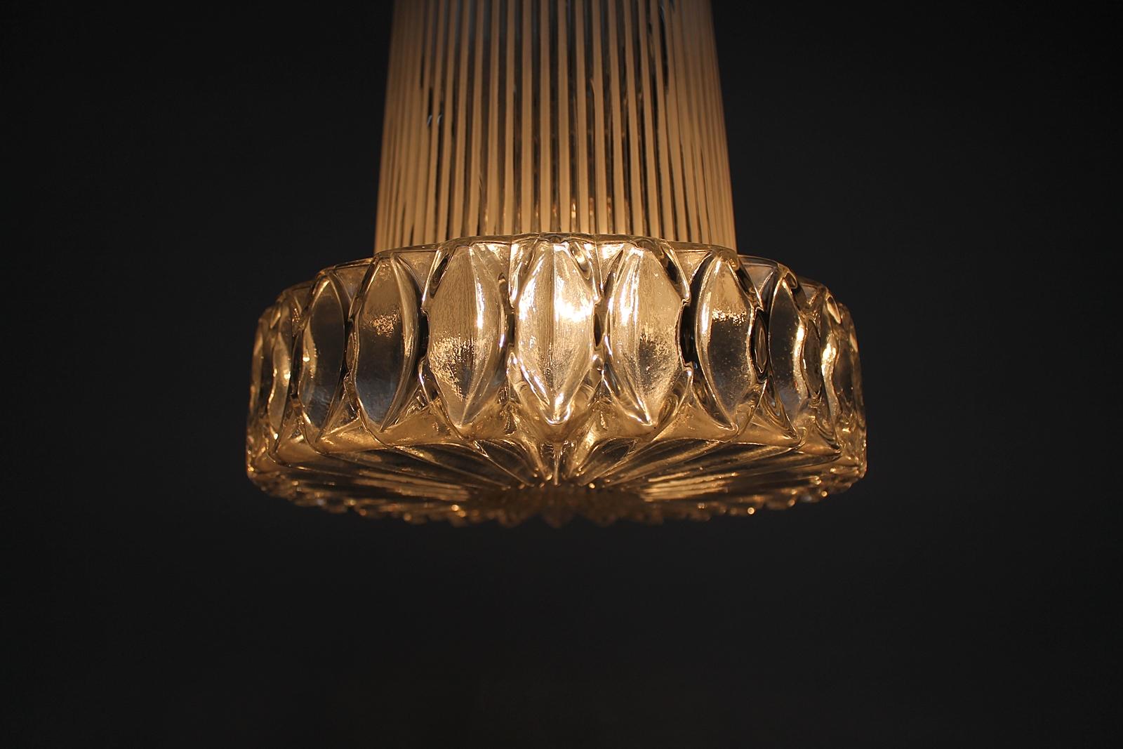 Very rare German origin midcentury large textured glass pendant lamp attributed to Aloys Gangkofner by Peill & Putzler.
Very elegant 1950s design.
Made of very thick patterned glass.
Makes a great charming light and is very decorative in any
