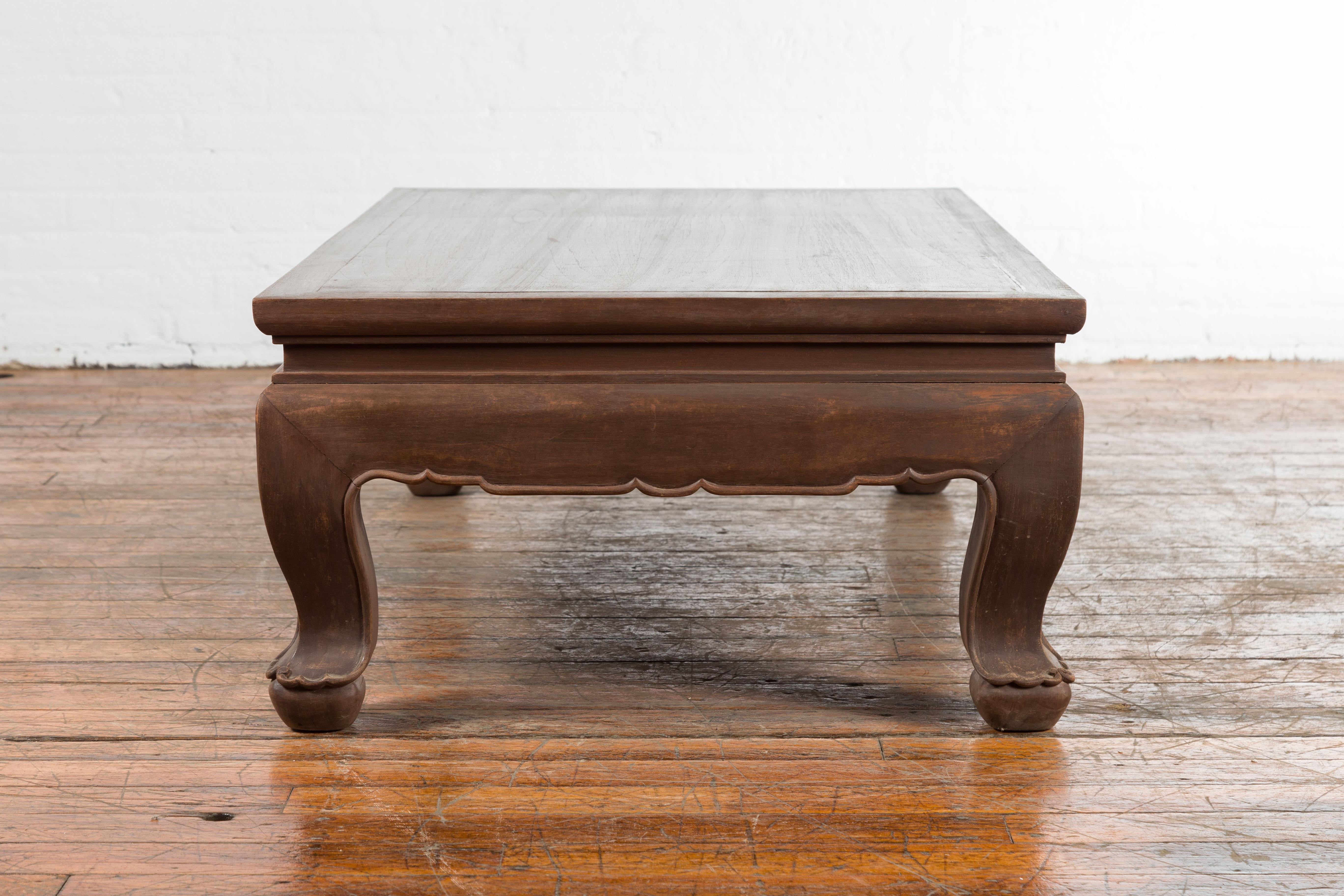 Vintage Thai Brown Wooden Coffee Table with Waisted Carved Apron and Chow Legs For Sale 3