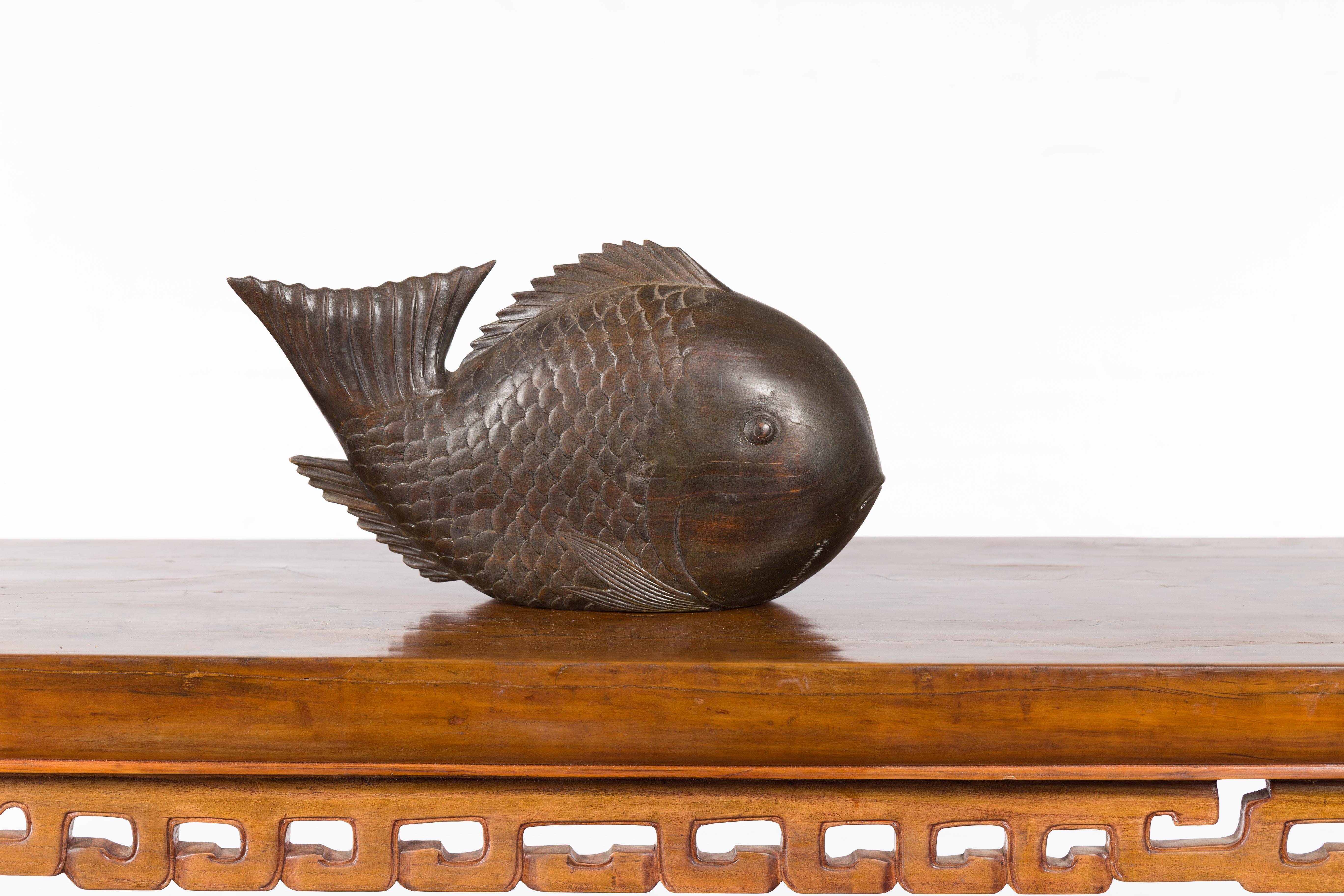 Vintage Thai Carved Wooden Carp Sculpture with Detailed Scales and Dark Patina In Good Condition In Yonkers, NY