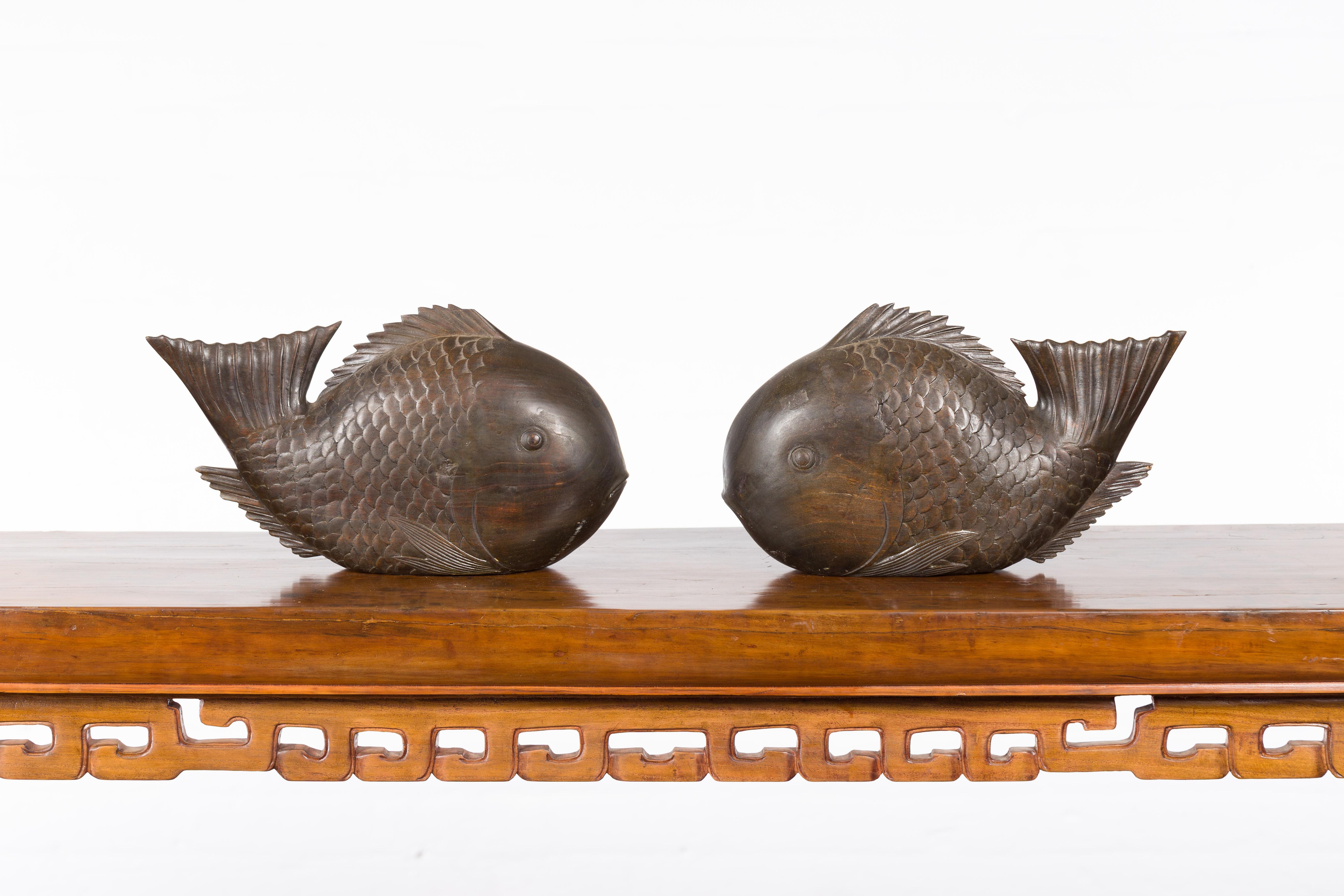 20th Century Vintage Thai Carved Wooden Carp Sculpture with Detailed Scales and Dark Patina