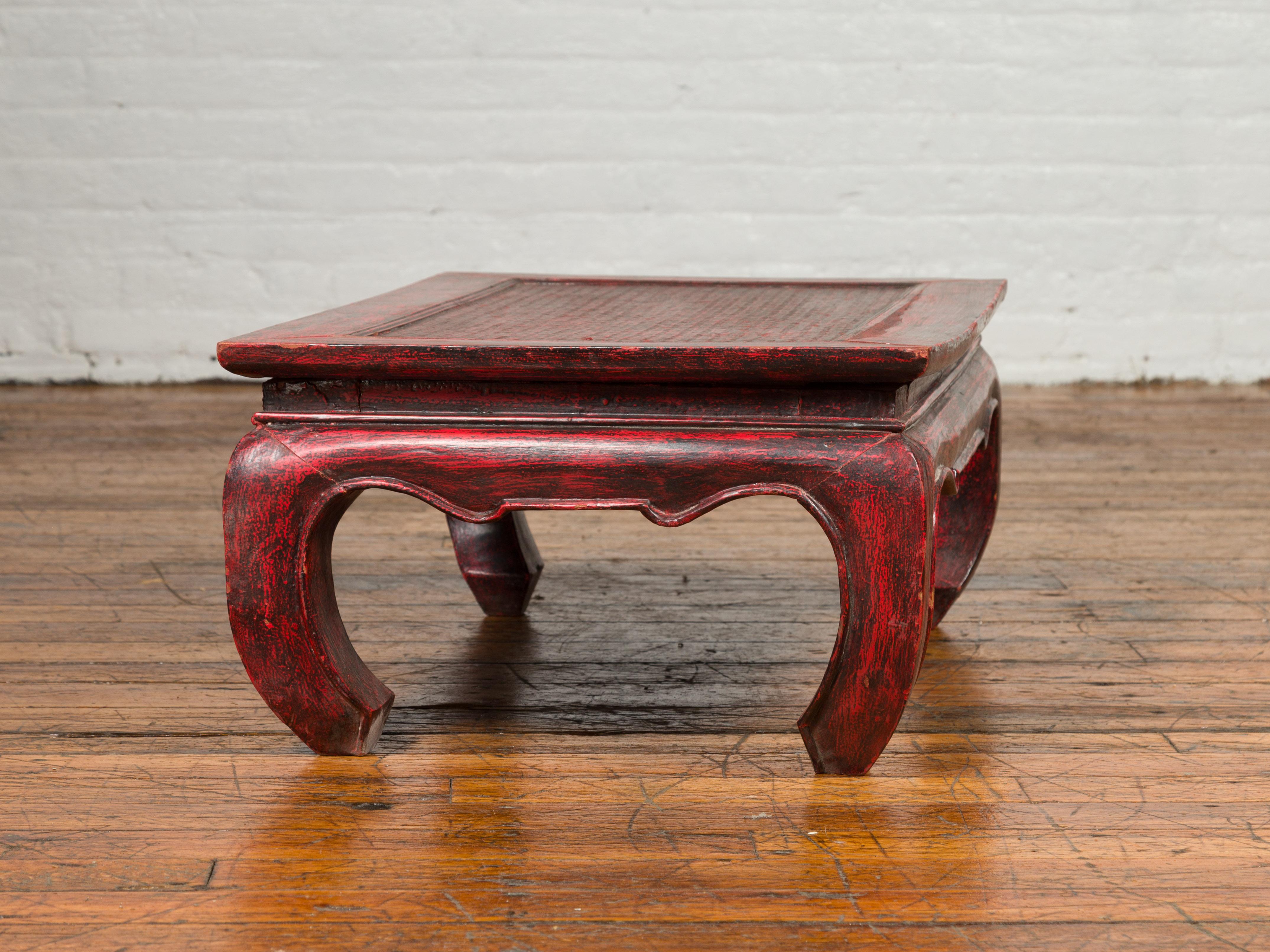 20th Century Vintage Thai Red Lacquer Waisted Coffee Table with Rattan Inset and Chow Legs For Sale