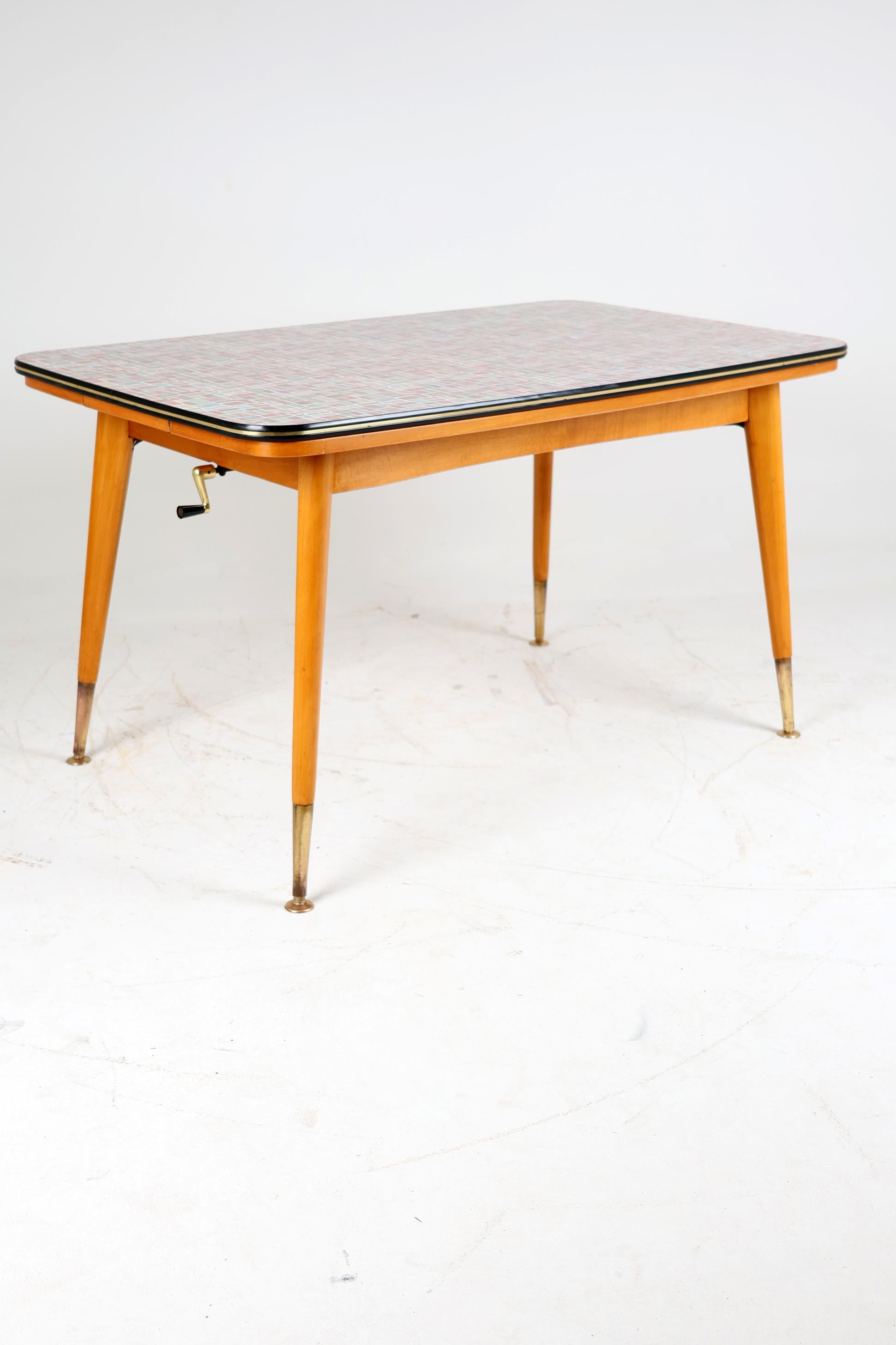 Vintage The Rockabilly Table 1960s

The table is decorated in the style of Rockabilly from the 60s. It has graphics on the top characteristic of the period. The table is height-adjustable and it is possible to add two smaller tops hidden under the
