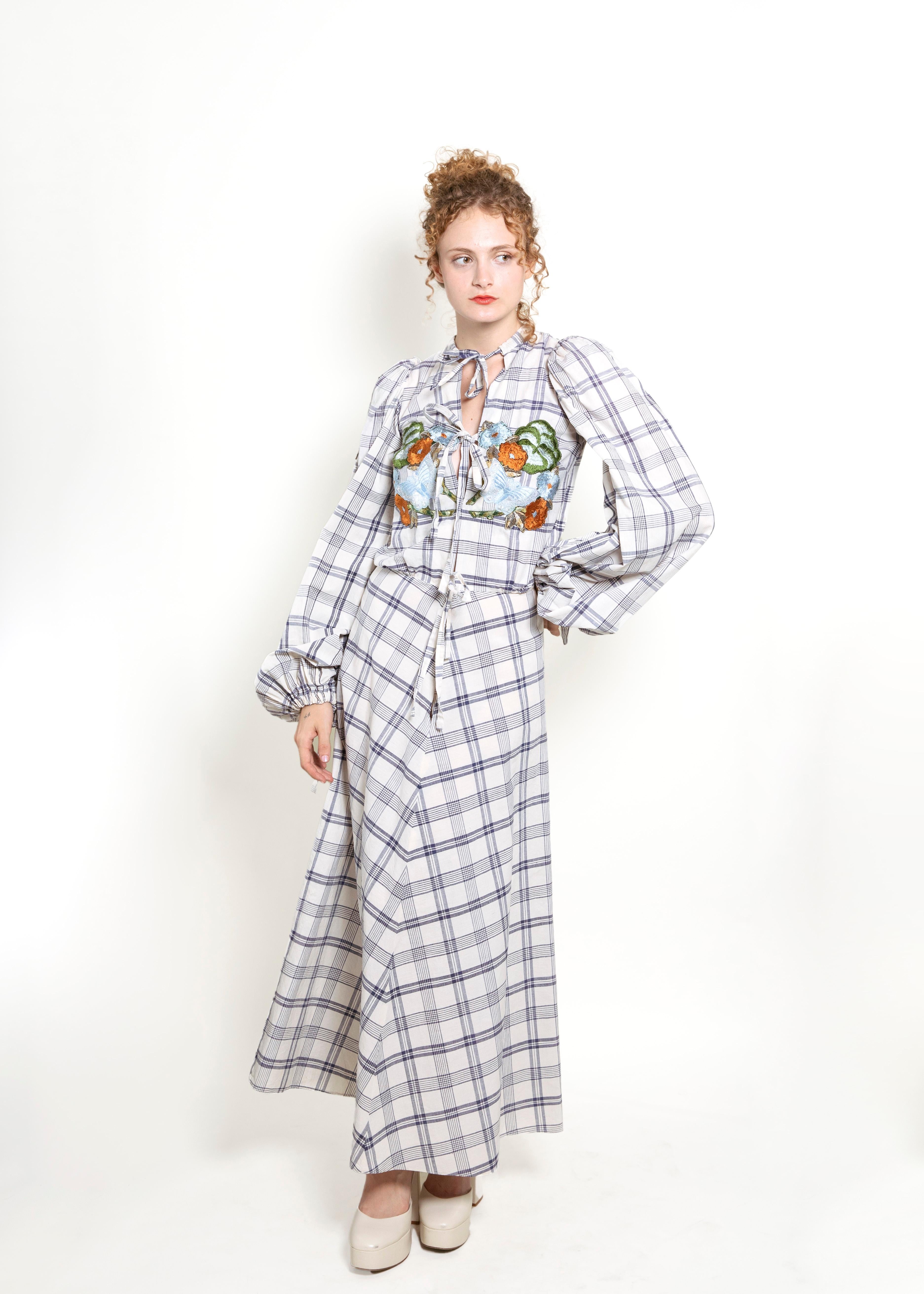 This vintage '71-'72 Thea Porter Couture dress is a total showstopper! With its exotic floral and butterfly embroidery making a stunning statement, you'll never go unnoticed in this beauteous maxi. The plaid print throughout, and  cap long sleeves