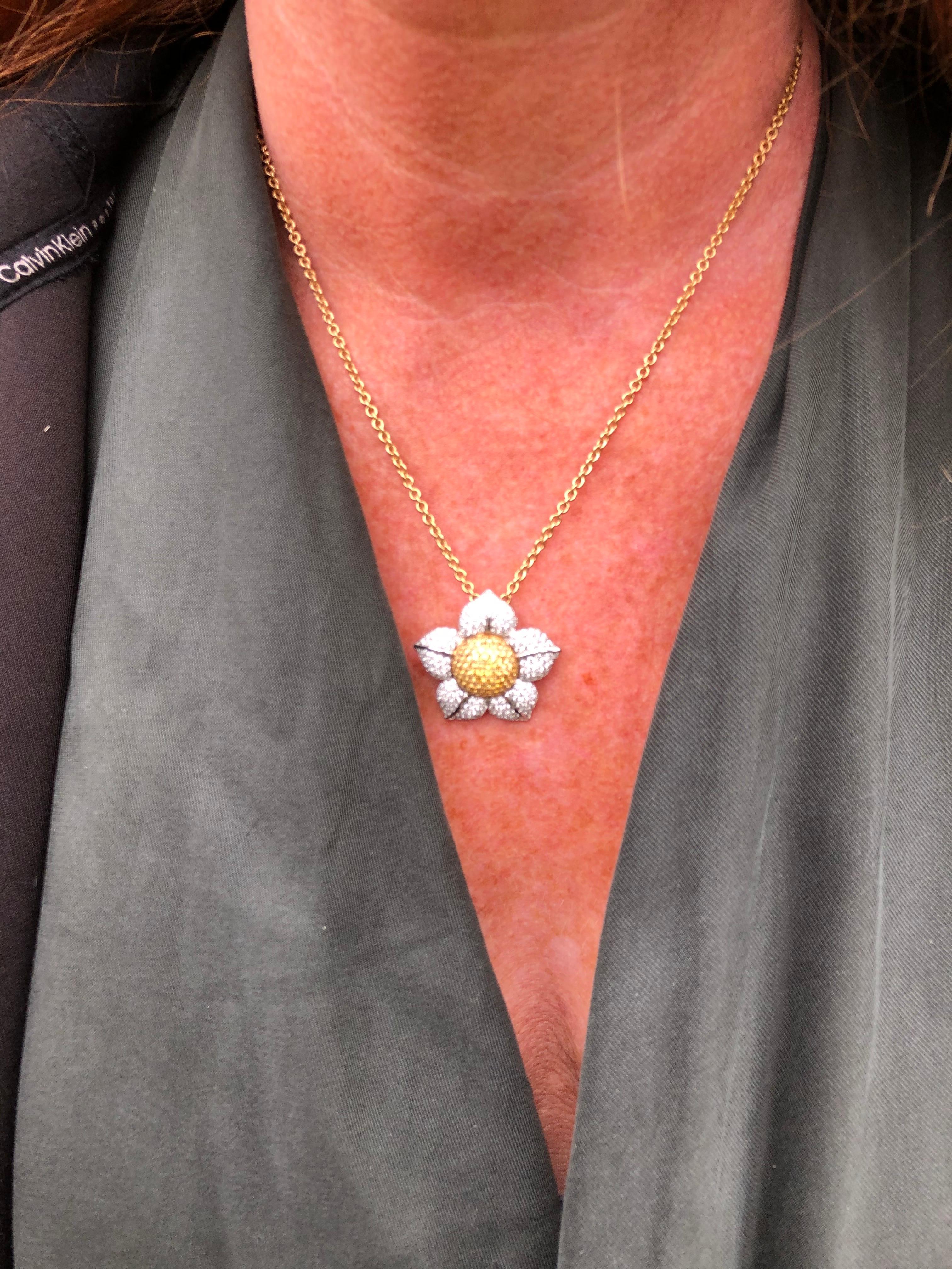 

This gorgeous daisy necklace is has diamond encrusted petals and the centre is made up of yellow sapphires. The necklace is modelled in 18ct white gold. 

*As you can see in our fourth image we have the matching ring to this necklace. 

Daisy