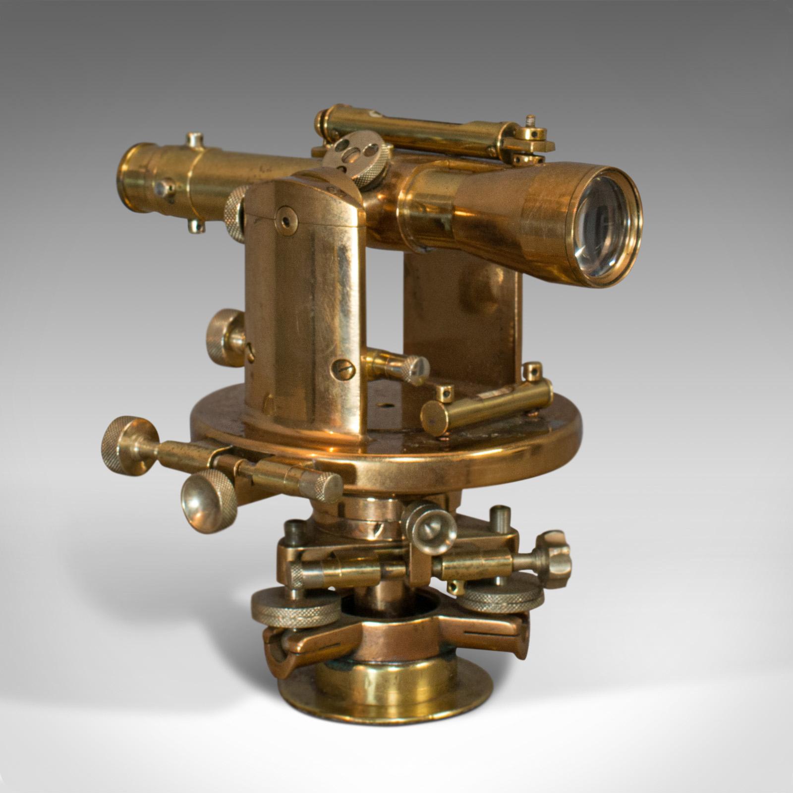 This is an antique theodolite. An English, bronze and brass scientific instrument or desk ornament, dating to the early 20th century, circa 1920.

Eye-catching period instrument
Displays a desirable aged patina
Polished bronze and brass finish with
