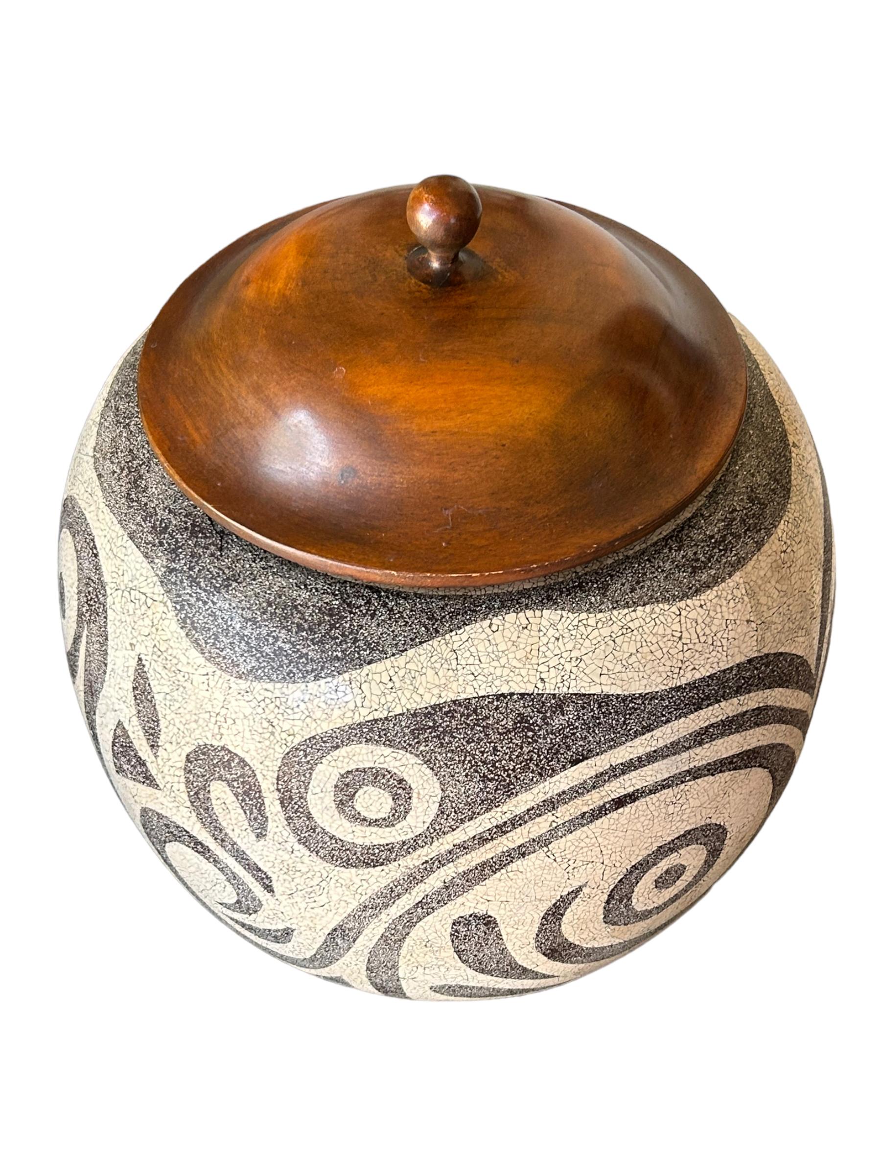 Theodore Alexander, founded by Paul Maitland Smith, an industry legend who developed high end furniture production throughout Asia, is one of the leading manufacturers of fine furniture.  This vintage pottery pot is a striking piece of art that