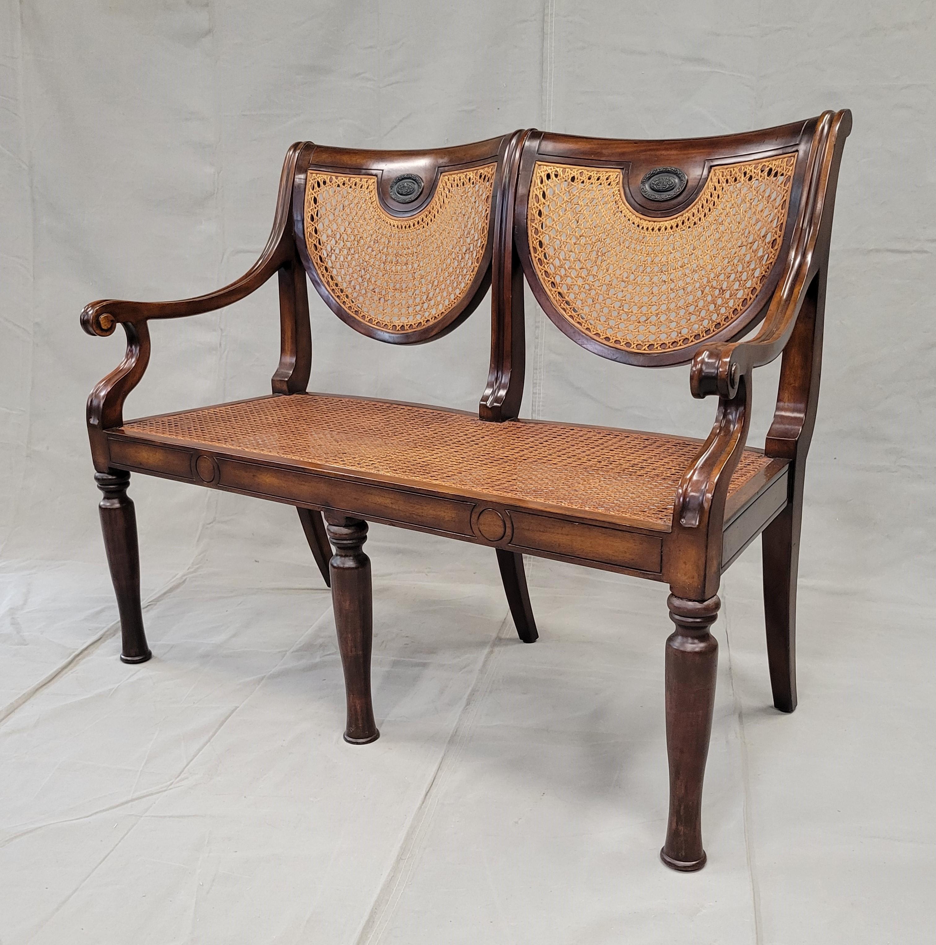 An elegant, Regency style vintage Theodore Alexander caned settee bench with luxurious champagne velveteen and silk down seat cushion. Bench can be used with or without the cushion. Strong and sturdy, ready for many years of use. Theodore Alexander