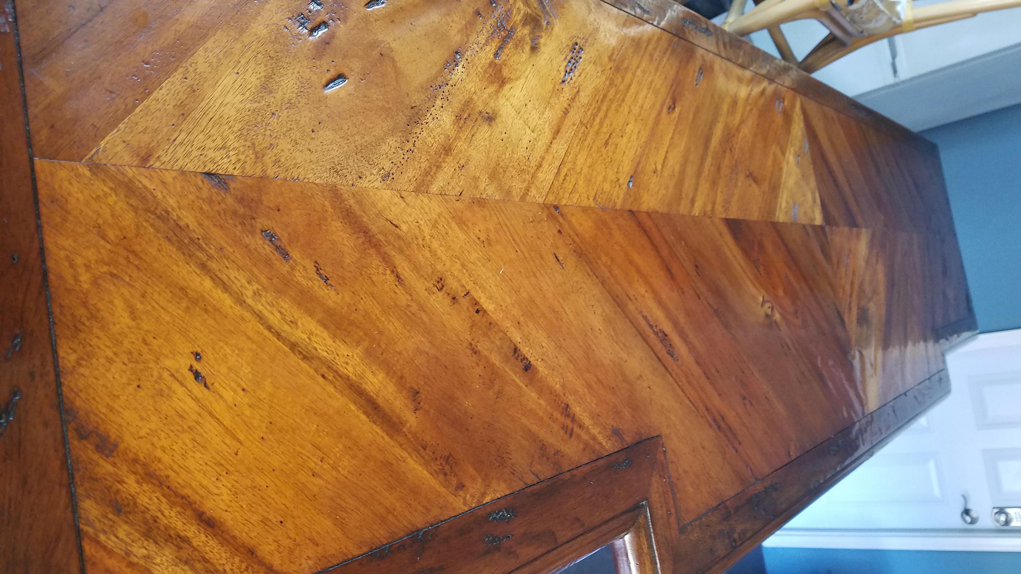 Beautiful vintage Theodore Alexander sideboard. Look closely at the pictures to see the detail of the hand antiqued wood. This piece is solid hardwood with tones of medium to dark wood to create a timeless parquetry on the sides, top and front. From