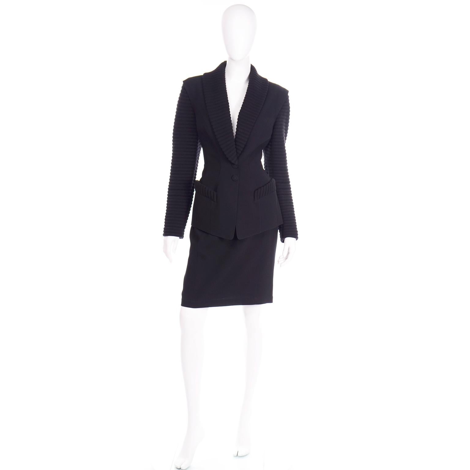 This is a fabulous vintage Thierry Mugler suit with a black wool knit ribbed shawl collar jacket and a black wool pencil skirt. The sleeves,shawl collar,and the trim of the pockets are all in a ribbed knit. As with all of Thierry Mugler's suits, the