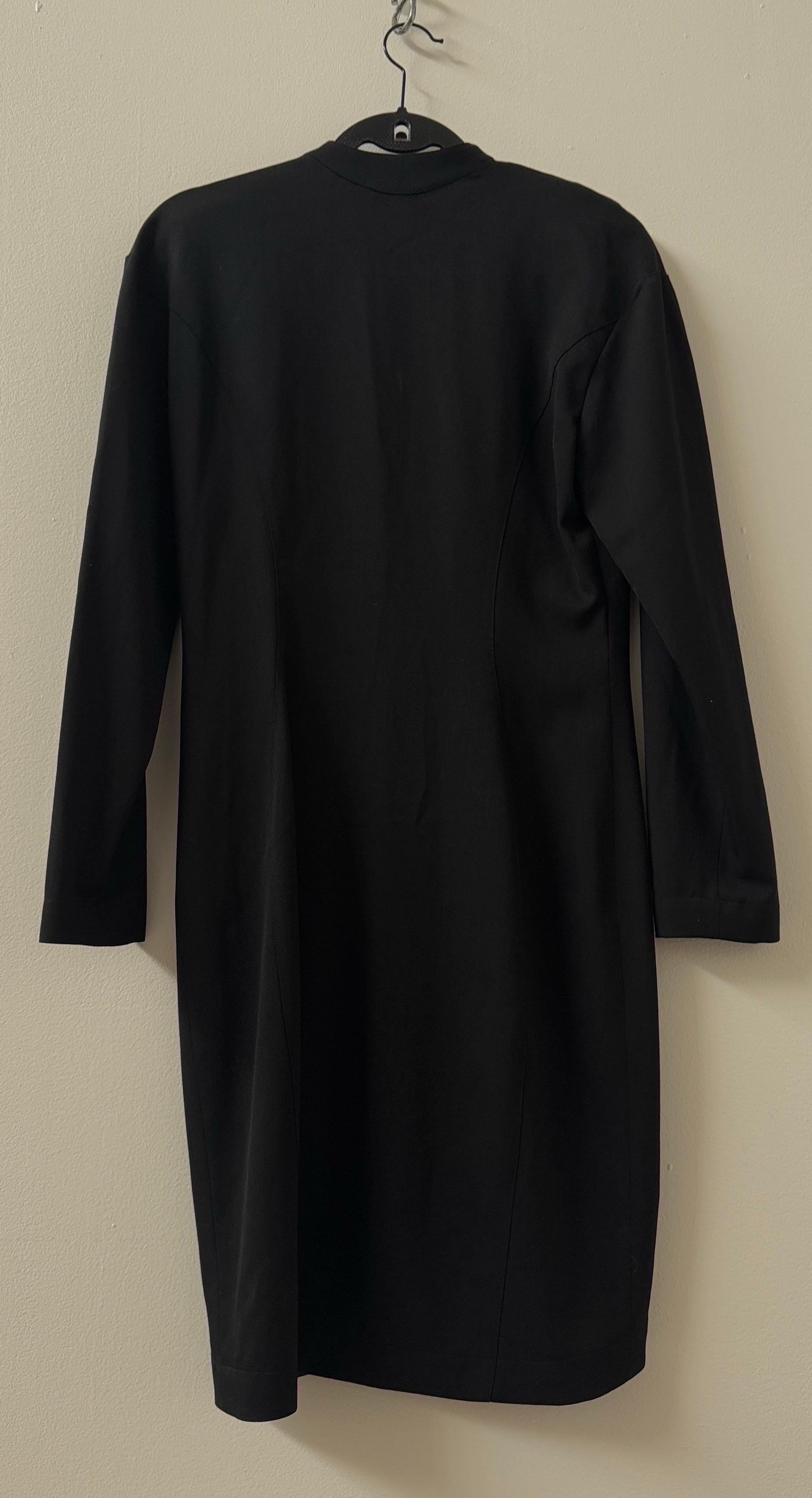 This vintage Thierry Mugler jacket from the 1990s is a striking example of the designer’s signature structured tailoring and avant-garde aesthetic. Known for his ability to sculpt the female silhouette with architectural precision, Mugler created