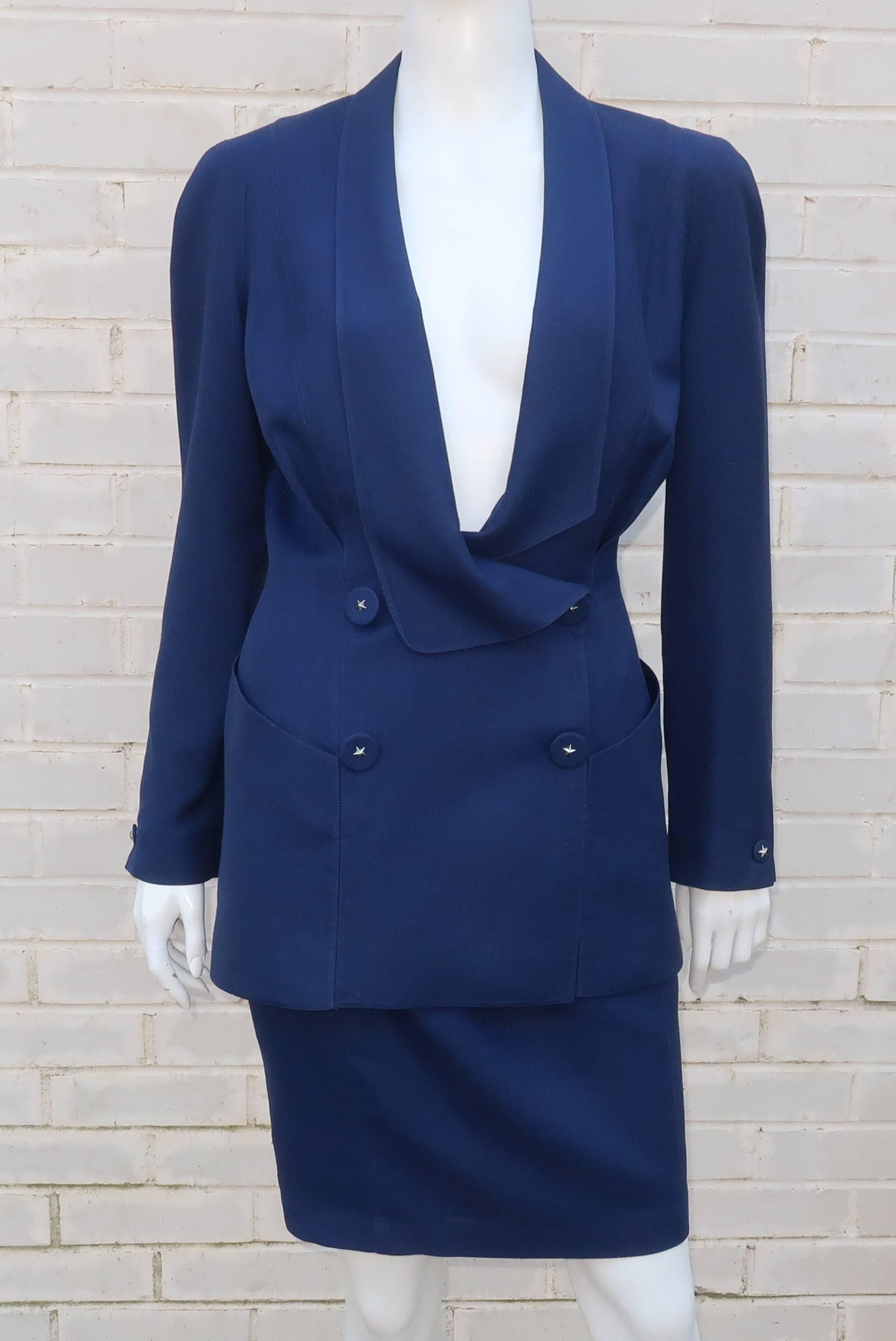 As with many of Thierry Mugler's designs, this 1980's linen suit is an inspired combination of a futuristic style with a nod to the strong silhouettes of the 1940's.  The shawl collared jacket has a softness to the shoulder line created by expert