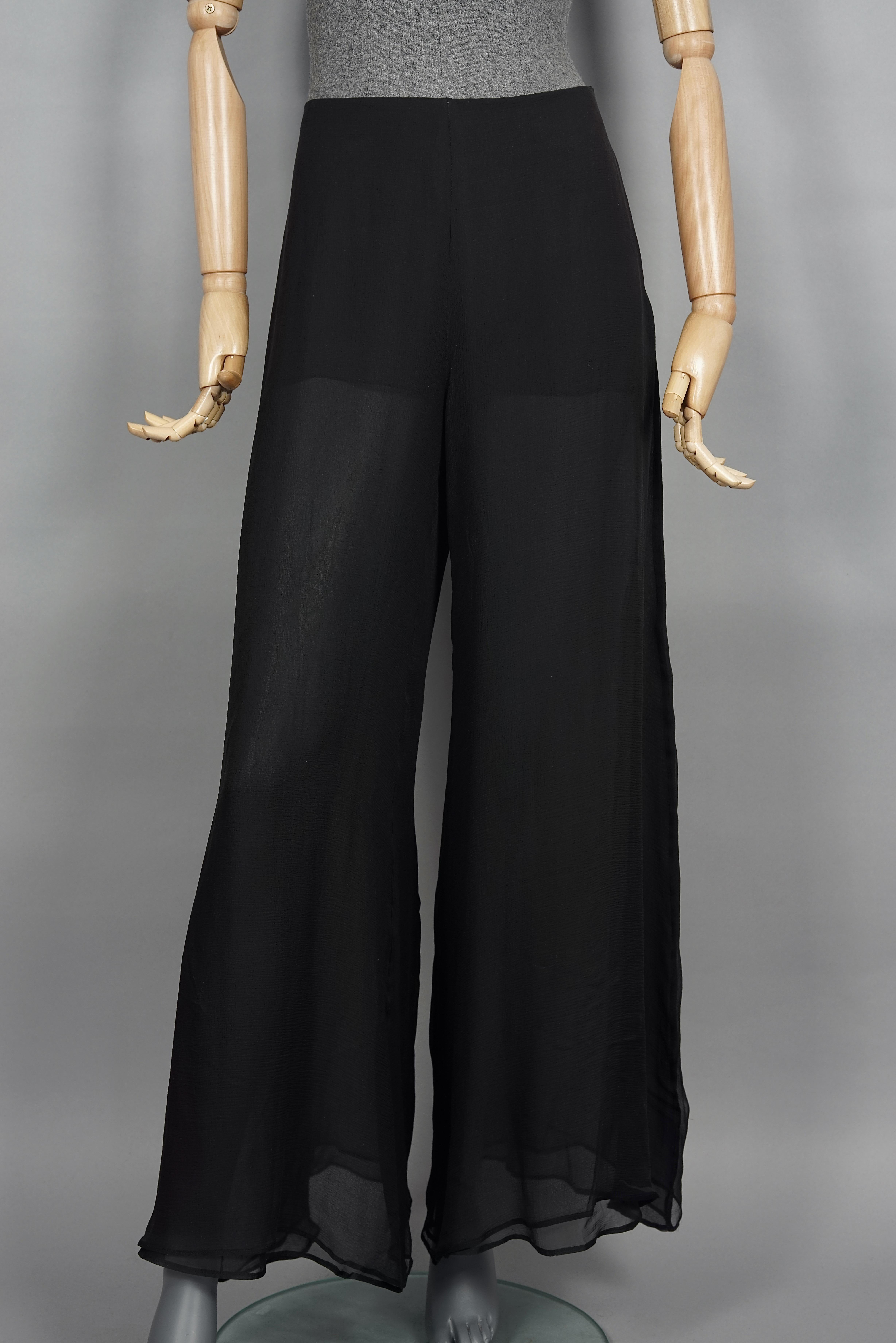 Vintage THIERRY MUGLER COUTURE Silk Sheer Palazzo Pants

Measurements taken laid flat, please double waist and hips:
Waist: 15 inches (38 cm)
Hips: 27.55 inches (70 cm)
Length: 42 inches (107 cm)
Hem Circumference: 19.68 inches (50 cm)

Features:
-