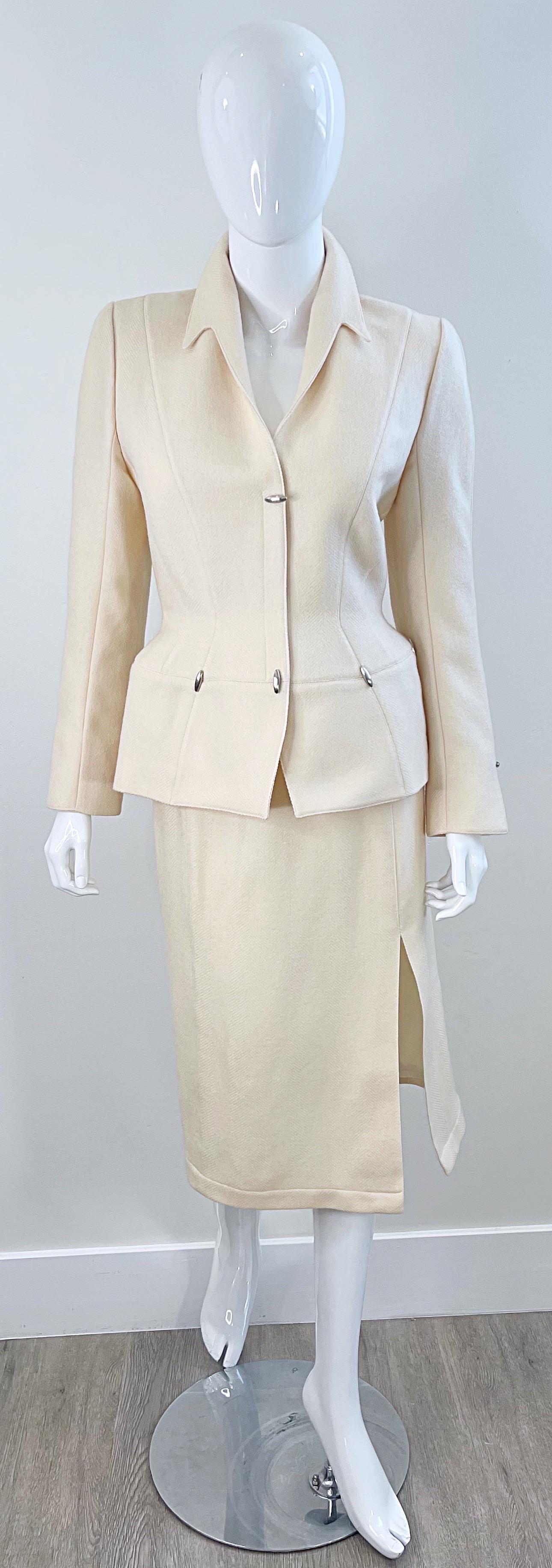 Avant Garde THIERRY MUGLER Fall / Winter 1989 ivory winter white wool skirt suit ! Features silver bullets around the waist of the jacket, and at center bust. Hidden snaps up the front. High waisted pencil skirt has hidden zipper up the back with