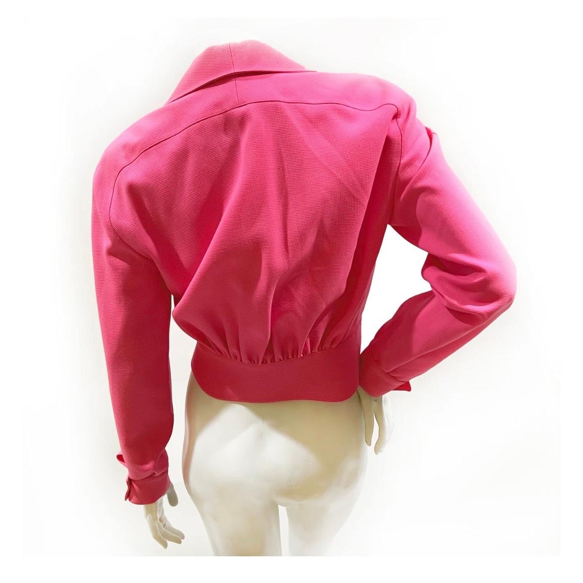 Vintage hot pink zip designer jacket by Thierry Mugler  
1990's
Made in France
Hot pink textured fabric  
Collared with square V neckline
Silver metal star logo zipper pull
Double snap cuff closures (silver metal stud shaped)  
100% wool (lining 60%