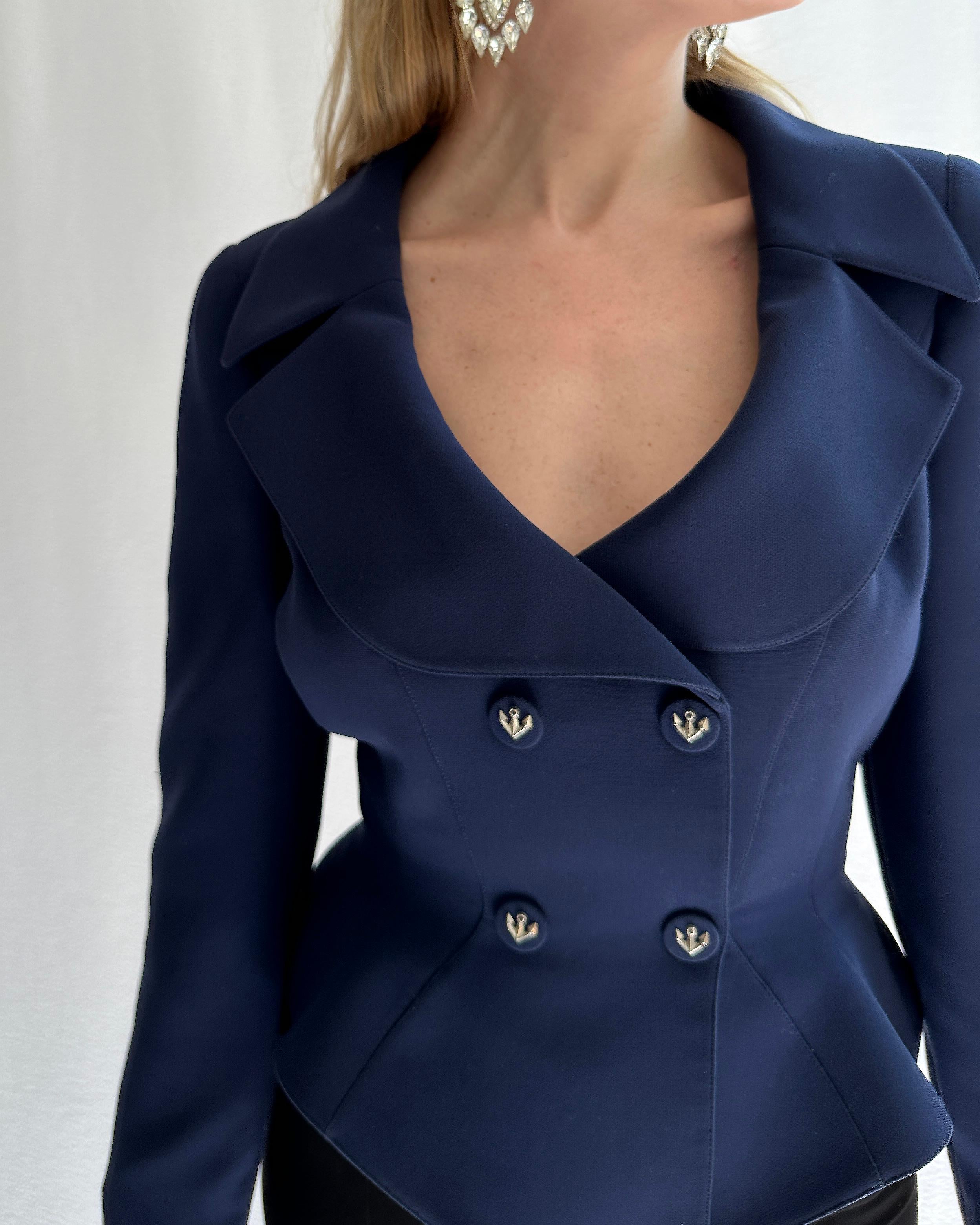 This classic Thierry Mugler blazer is a seriously timeless investment, with so many signature Mugler details making it a highly collectible piece: the exaggerated nipped waist with flared hips, the dramatic lapels, and the anchor details. Mugler