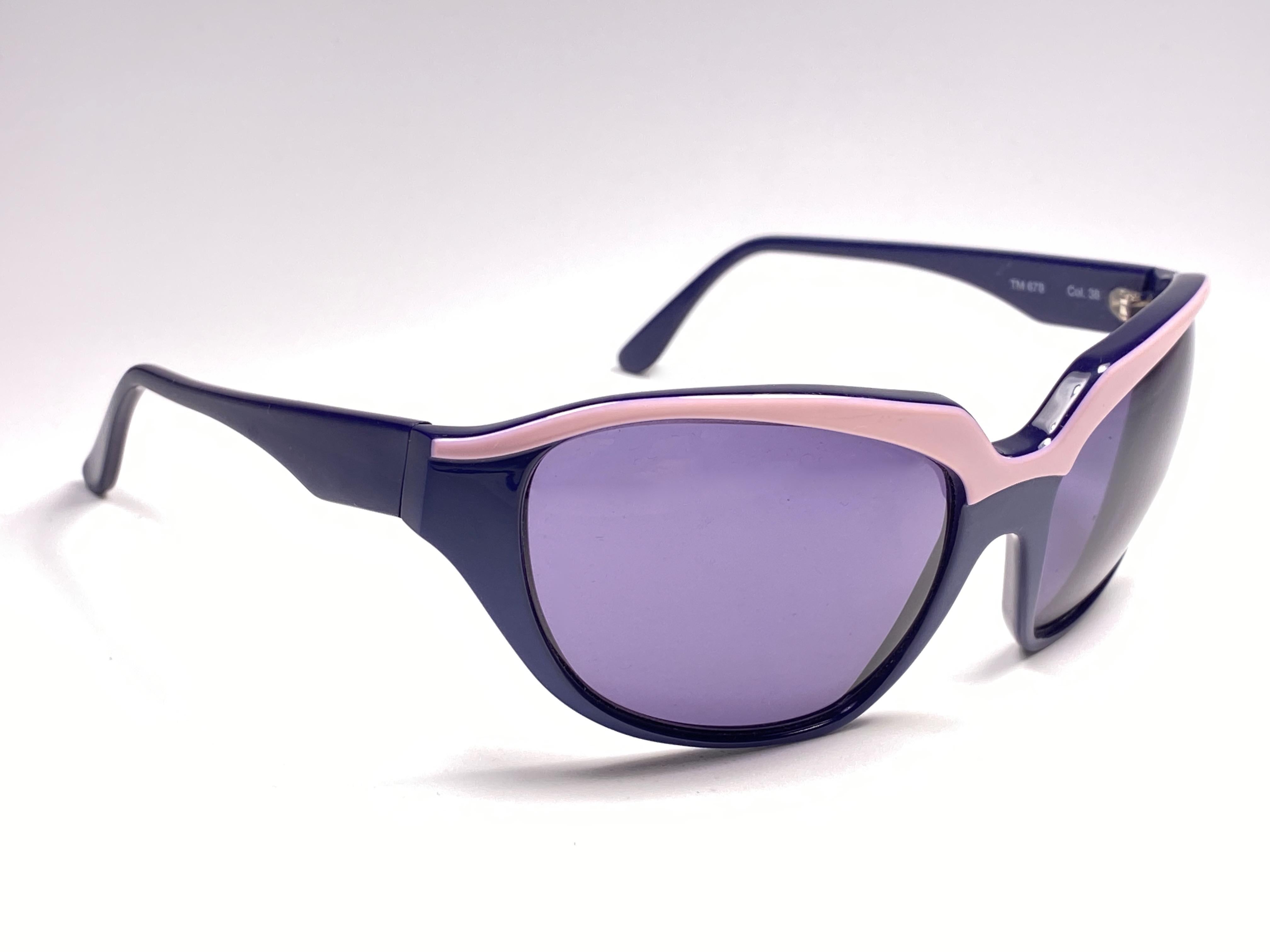 Super cool vintage THIERRY MUGLER 1980’s sunglasses. Bug eyed purple and pink frame with medium grey lenses.

This pair is an style statement. The piece could show minor sign of wear due to storage.

A great opportunity to achieve a unique and yet