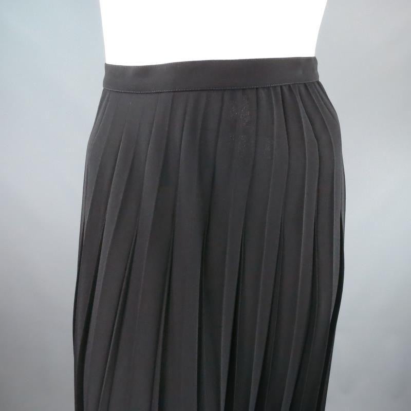 Vintage THIERRY MUGLER skirt comes in an ultra light weight semi sheer pleated polyester in a long ankle length A line cut. Made in France.

Brand New with Tags.

Waist: 27 in.
Hip: 52 in.
Length: 35 in.