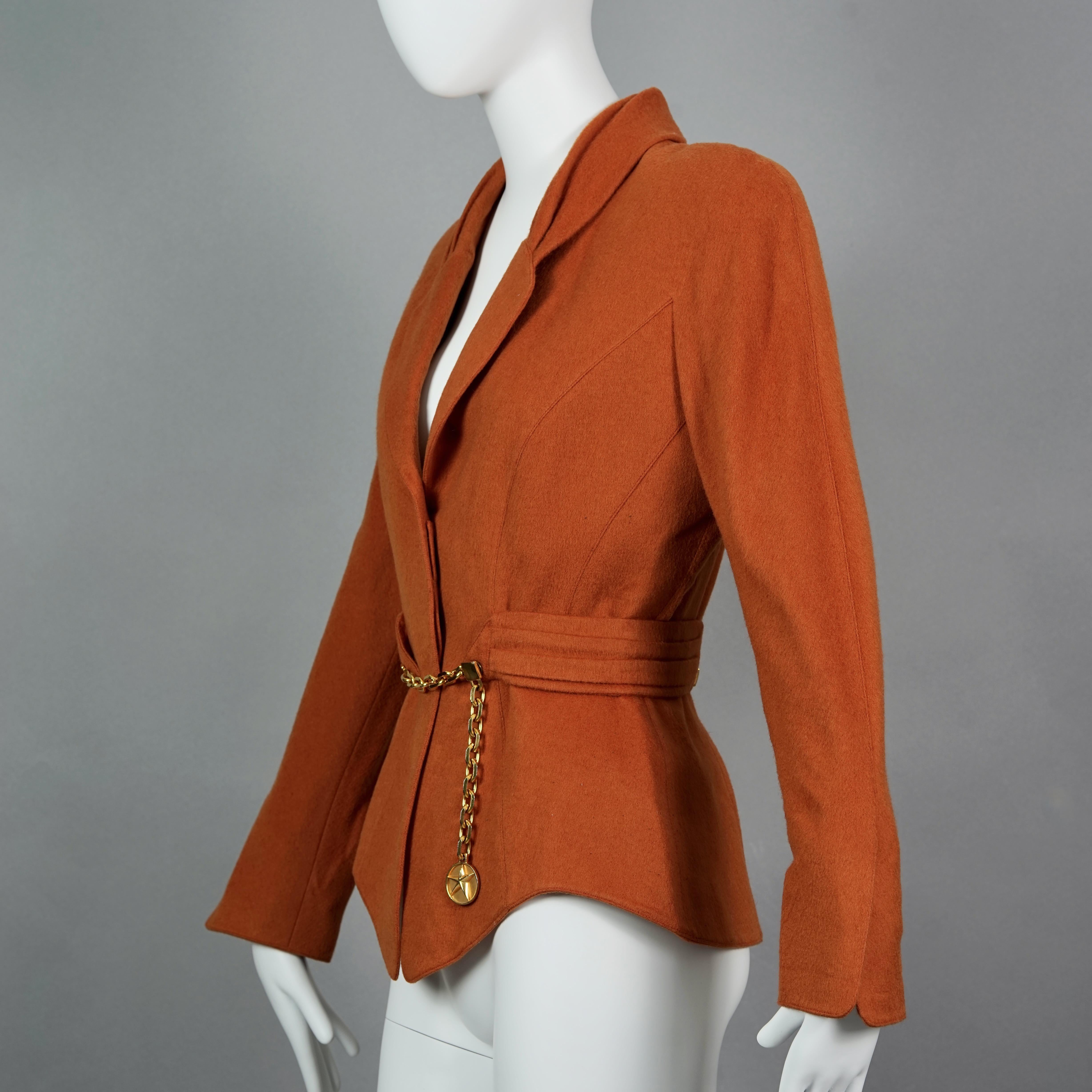 Vintage THIERRY MUGLER Structured Belted Chain Burnt Orange Wool Jacket

Measurements taken laid flat, please double bust, waist and hips :
Shoulders: 17.32 inches (44 cm)
Sleeves: 22.83 inches (58 cm)
Bust: 19.29 inches (49 cm)
Waist: 13.77 inches