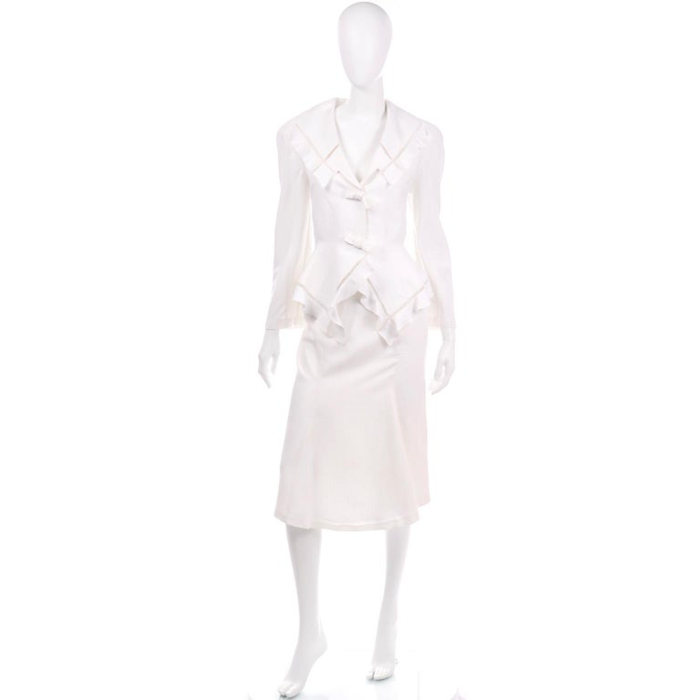 This gorgeous vintage Thierry Mugler linen blend skirt suit has so many unique details! You can wear the jacket with just about any other skirt or pair of pants you have in your wardrobe! The blazer jacket has cutwork on the lapels and is in Thierry
