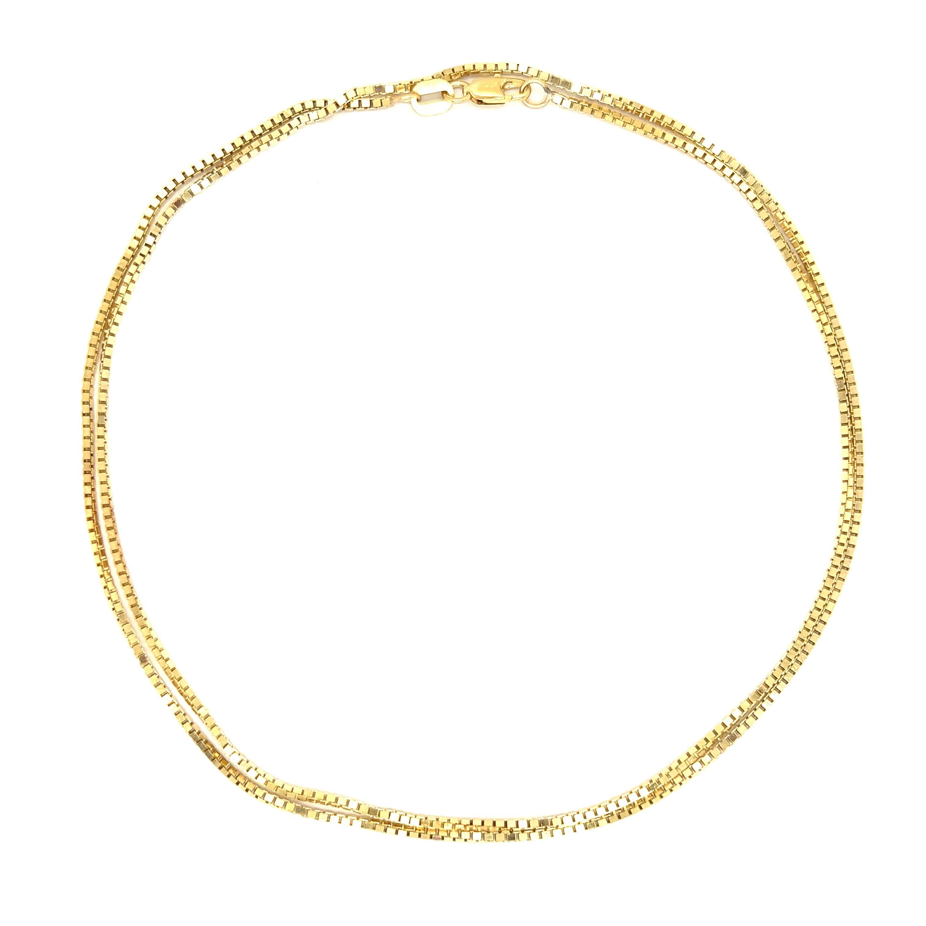 Introducing our sleek and elegant thin 14K Gold Box Chain. Crafted with precision and finesse, this delicate chain exudes sophistication and versatility. Its slender design adds a touch of understated glamour to any outfit, whether worn alone for a