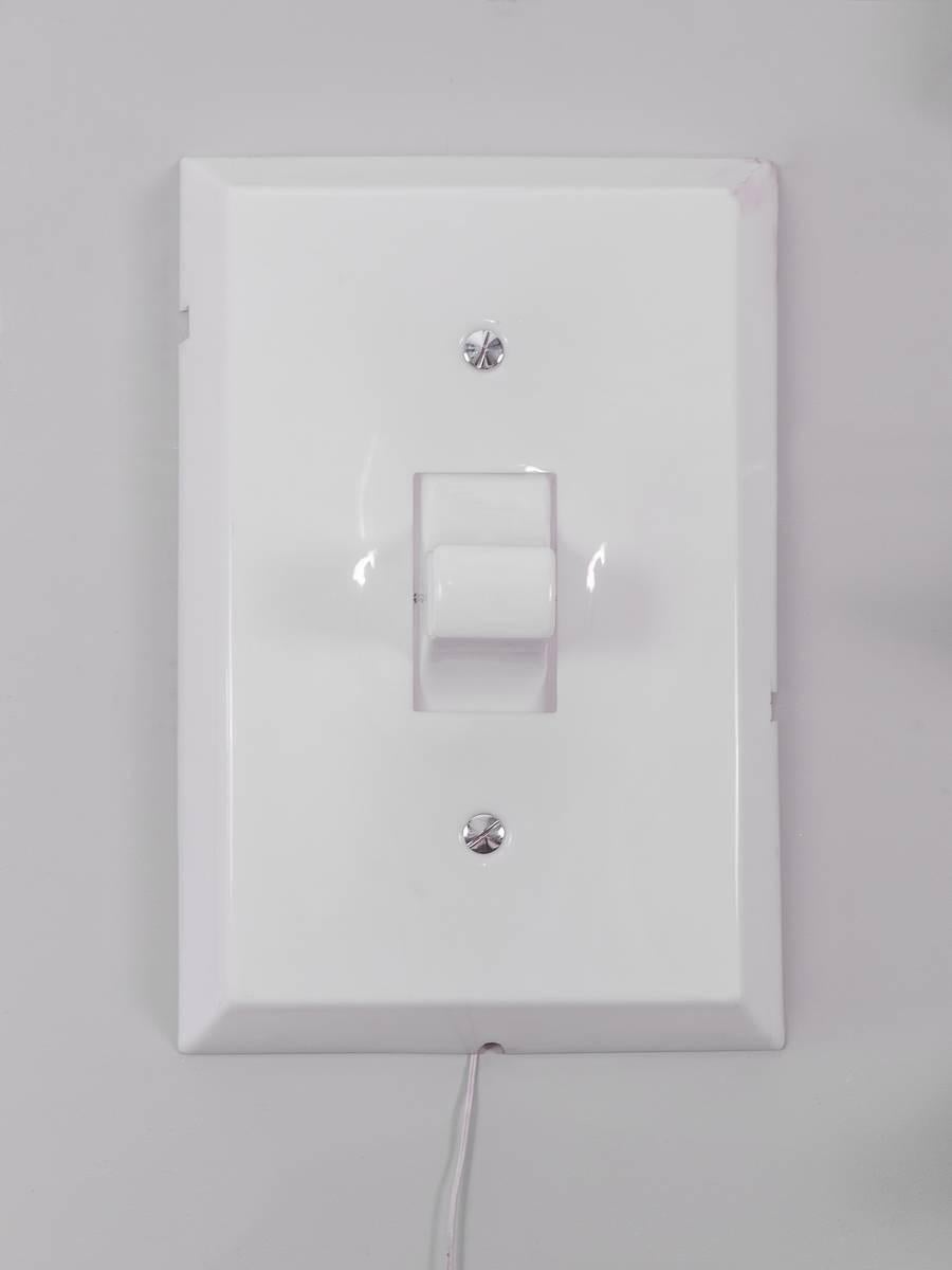 Vintage 1980s Think Big! Light switch. Brighten any room with this rare pop-art artifact. This wall mounted sculpture functions exactly as it is advertised with the switch moving up and down to turn the light on and off. Some age-appropriate wear to