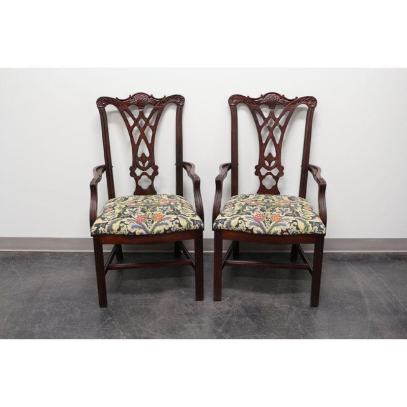 A pair of Chippendale style dining armchairs by Thomasville. Solid mahogany frame, fabric upholstery, carved backsplats; on a stretcher base with straight legs. Made in the USA in the late 20th Century. Style #: 14521-842

Measures: Overall: 22.5 W