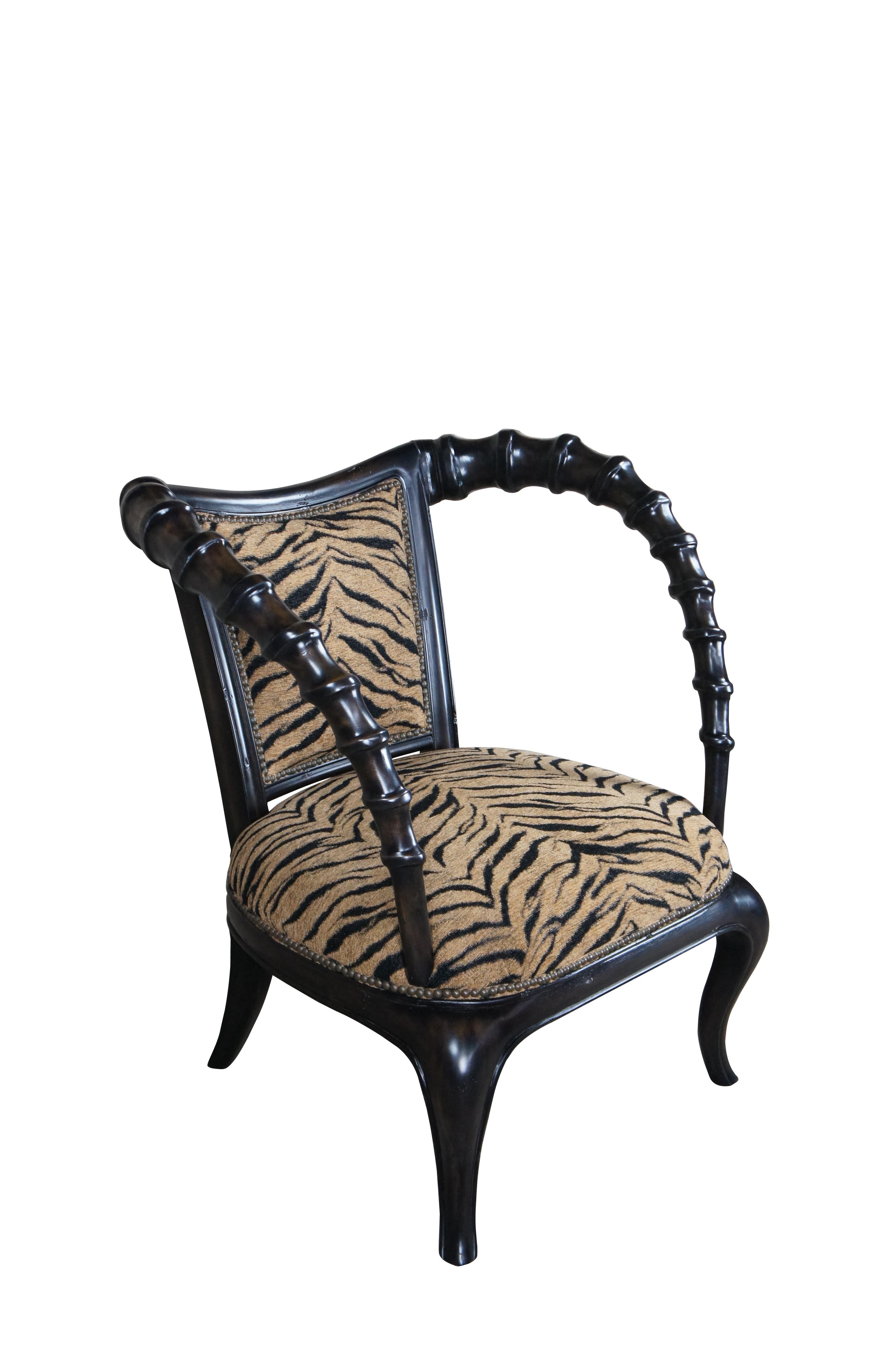 Vintage Thomasville Ernest Hemingway African Collection arm chair featuring dark wood frame with antelope horn style arms and zebra fabric.

Dimensions:
33