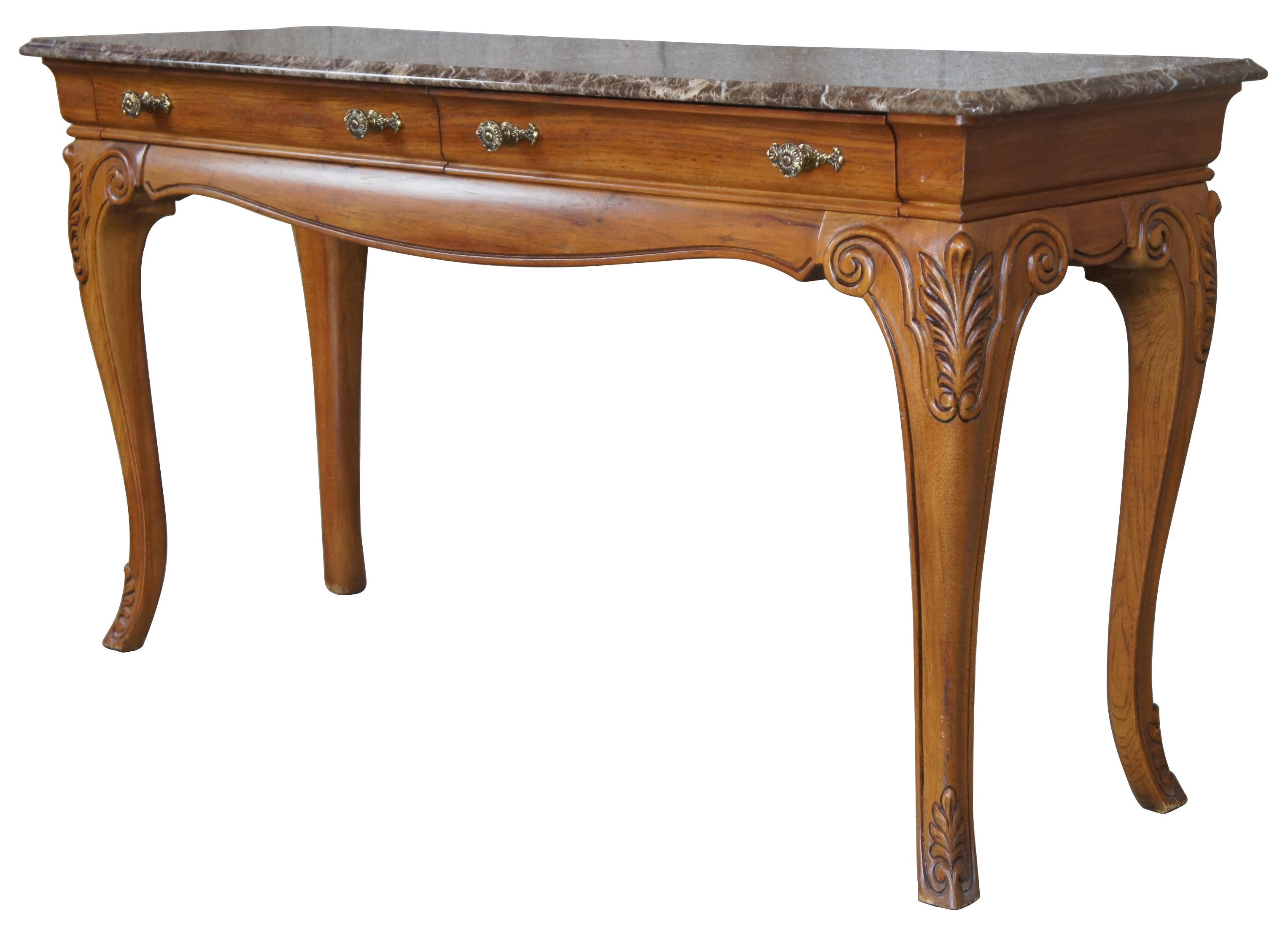 Thomasville Furniture French Country sofa table, 27131-722. Circa 1990s. Made of oak with serpentine form and cabriole legs. Features two drawers and a brown / tan / white marble top. Measure: 55