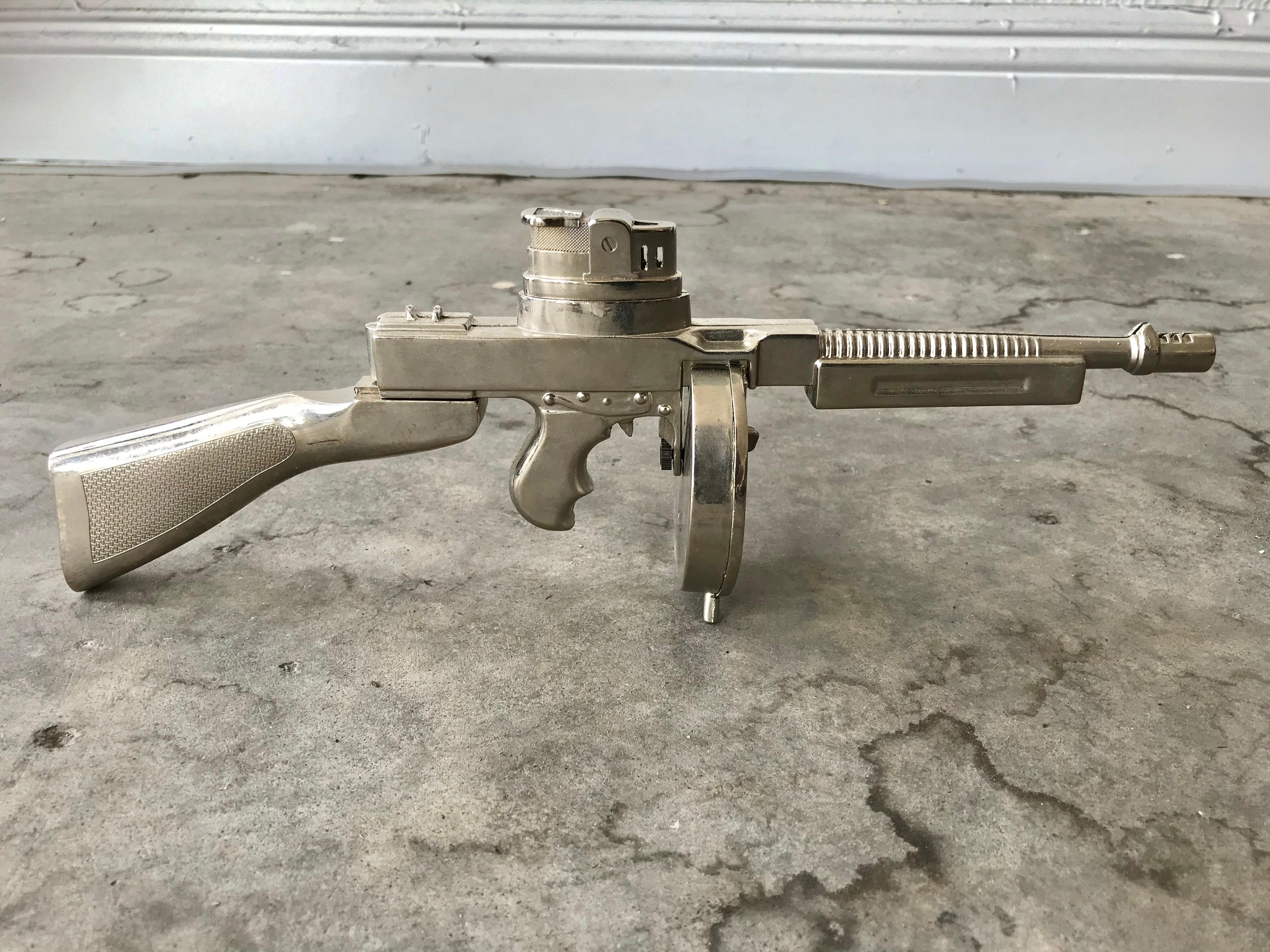 Cool vintage table lighter in the shape of a Thompson, single action revolver handgun. Made of metal and stands up on its own. Cool tobacco accessory and conversation piece.

 