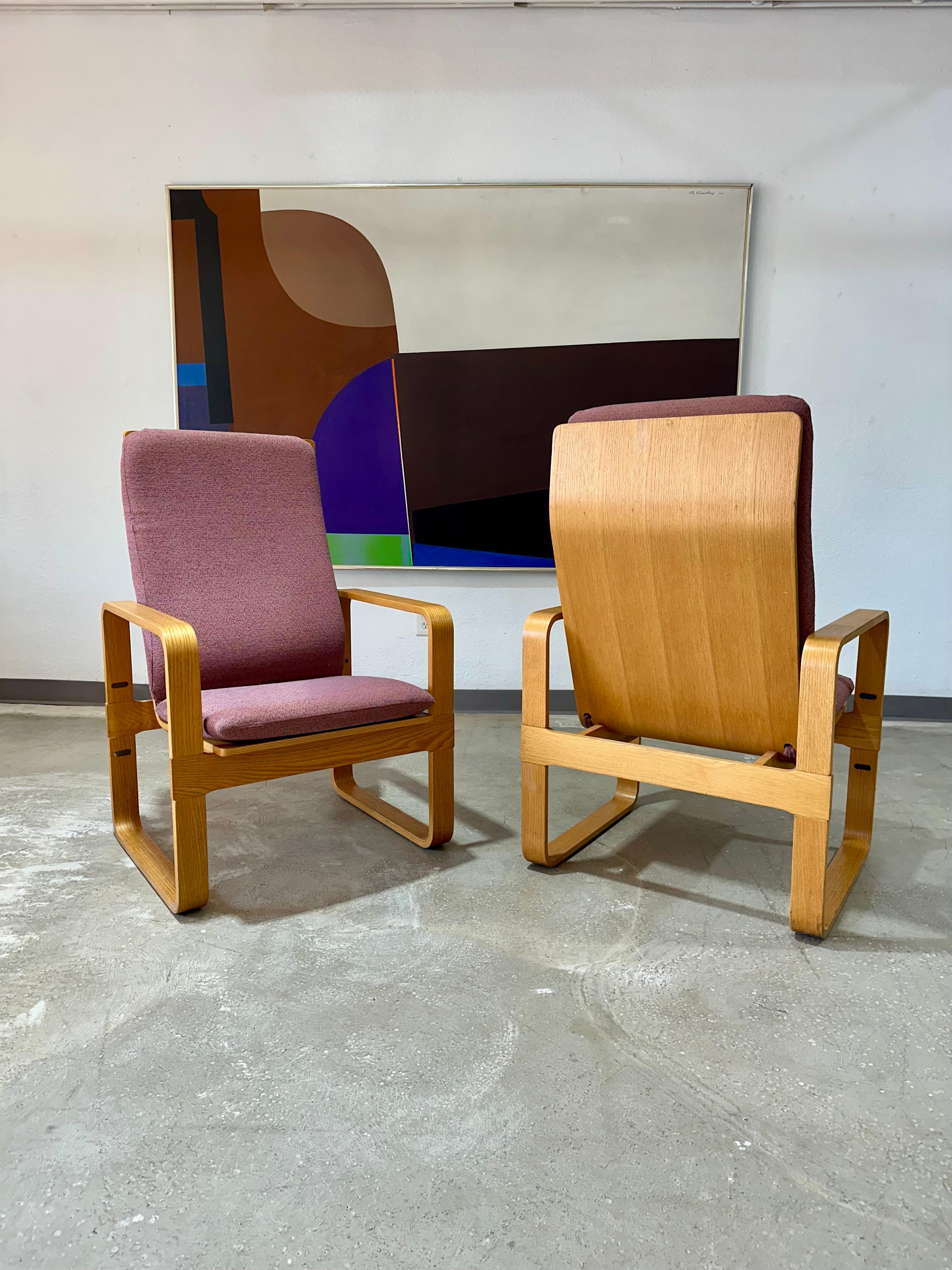 Pair of Vintage Thonet Beech Bentwood Highback Lounge Chairs c.1980’s. Sculptural bentwood frames with purple textured multi tonal cushions. 42”H x 25”D x 26.75”W
SH/SD 17.75” x 18”

Condition: Good original vintage condition. some pilling to