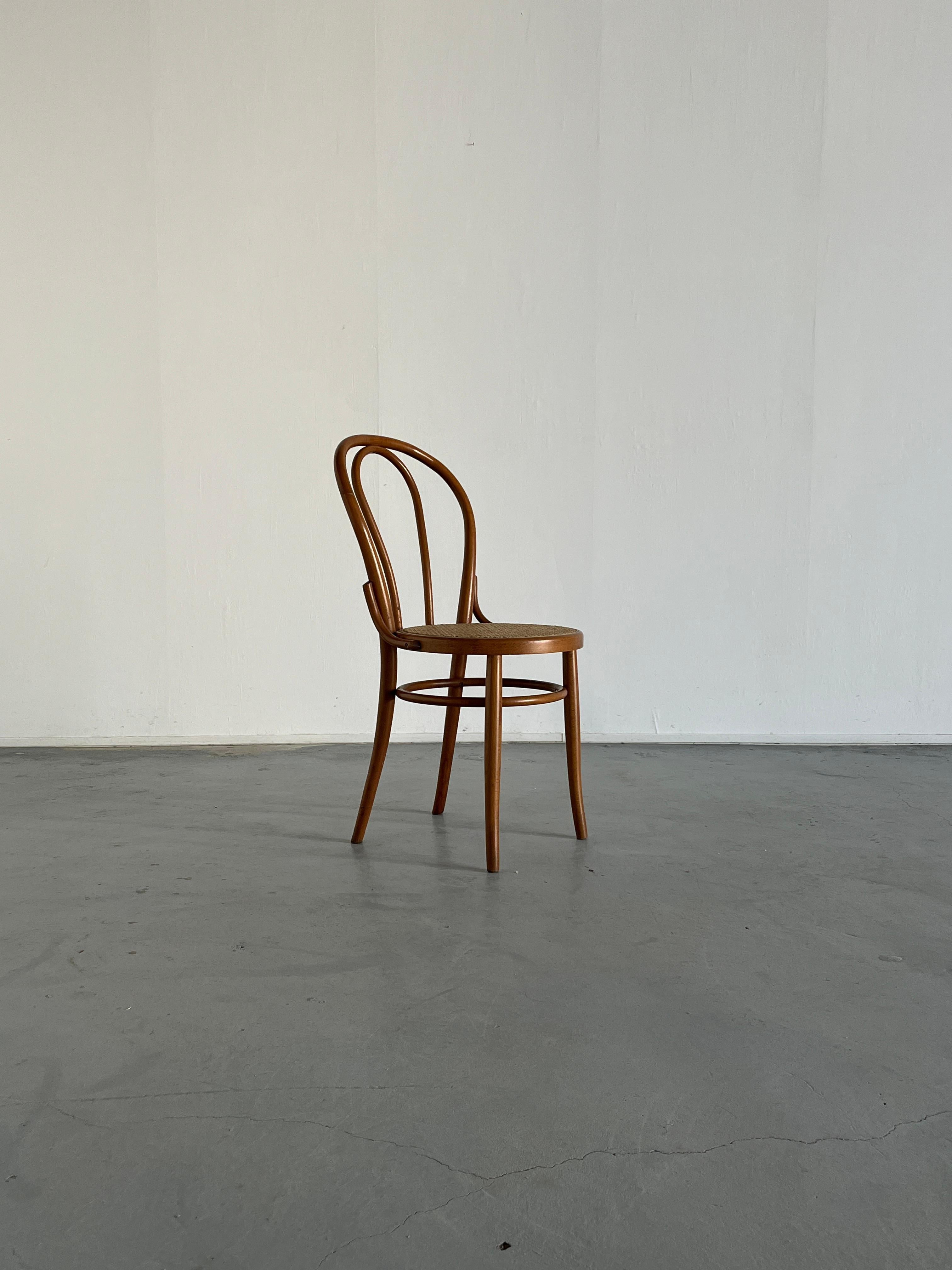 A beautiful, wooden Thonet bentwood chair, in style of the popular model no. 18.

Based on the dimensions, materials, weight and type of screw, it is most certainly an original Thonet no. 18 chair produced by the Thonet Mundus factory in former