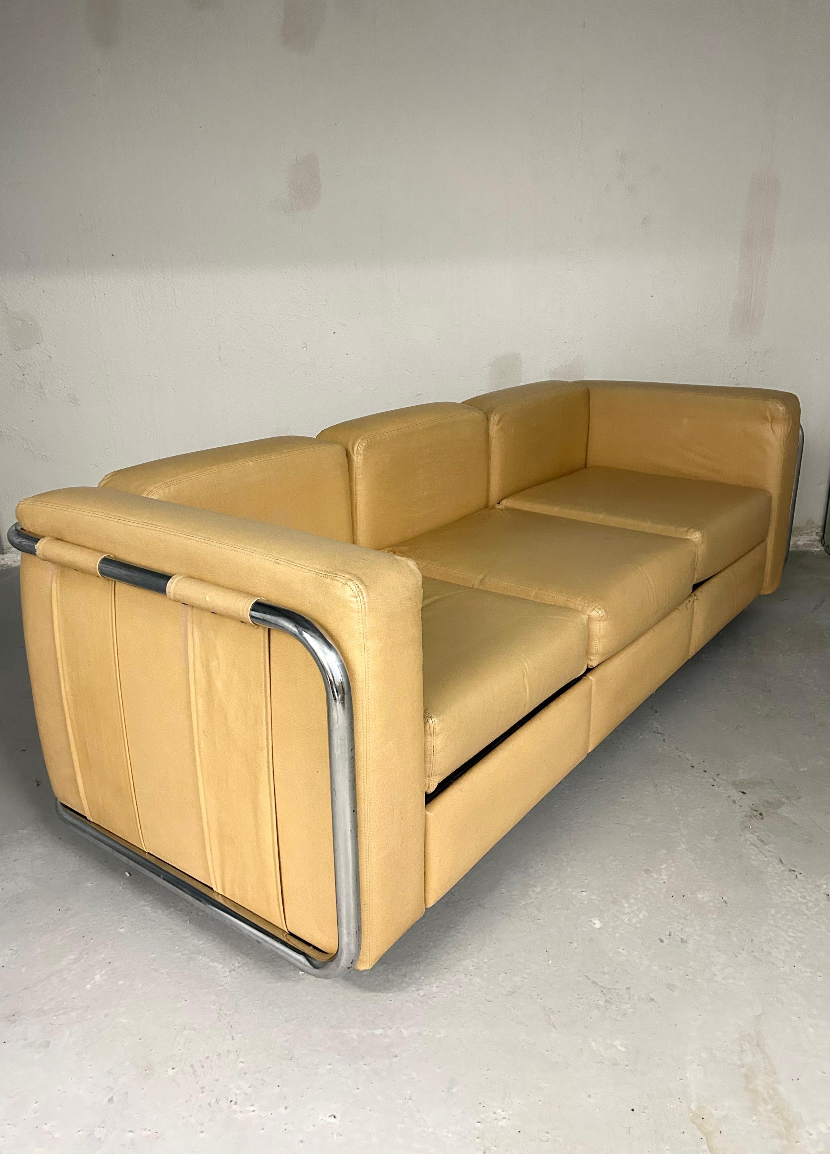 1970s Thonet sofa with wrap around chrome frame and strap detail. Faux leather upholstery and chrome have normal wear for age. Original tags.

80” length
26” height
31” depth
16” seat height