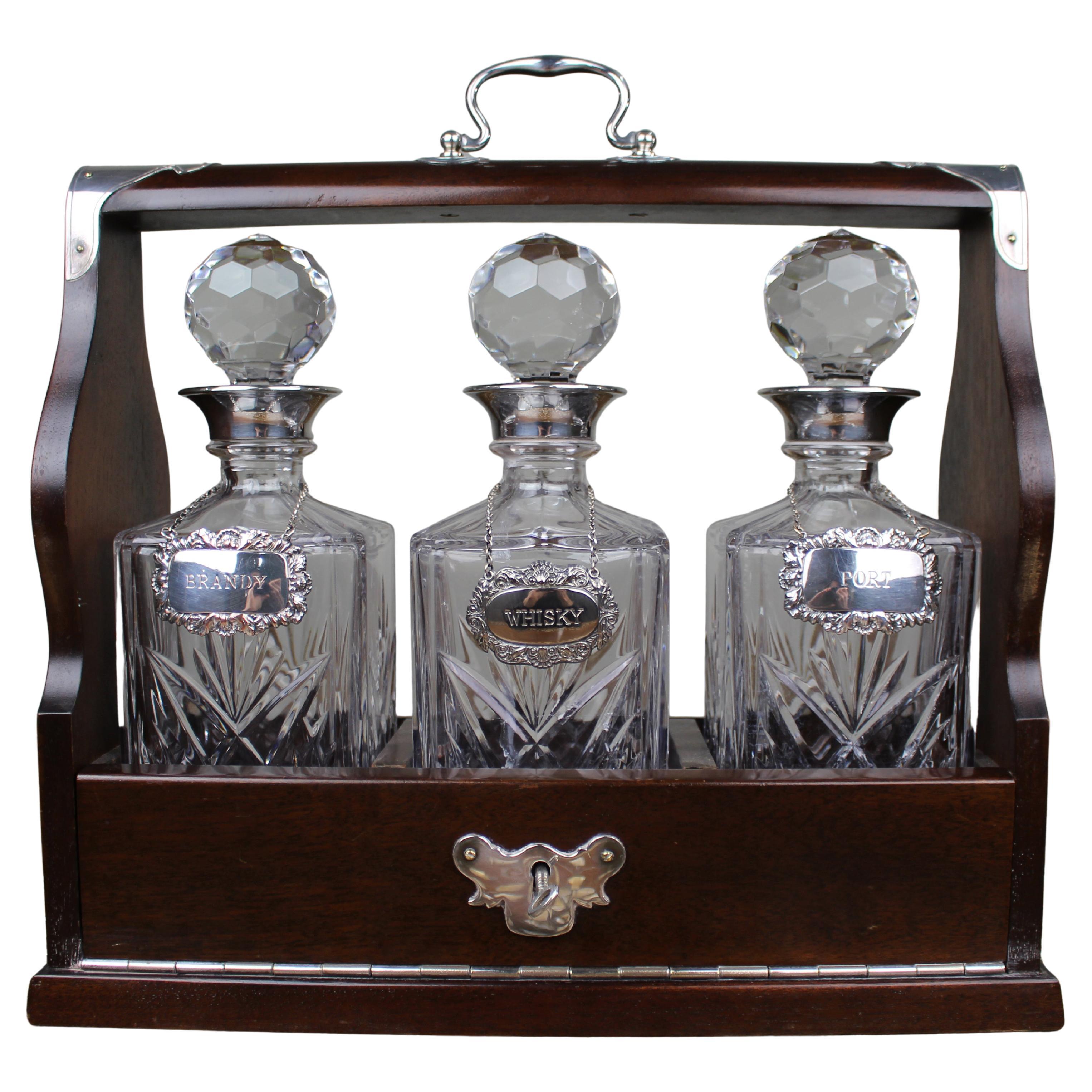 Vintage Three Bottle Cut Crystal Tantalus with Silver Plated Mounts For Sale