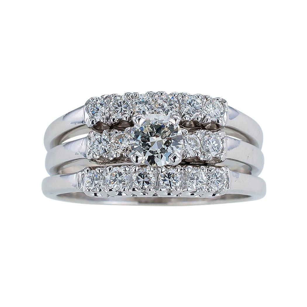 Vintage three-ring diamond engagement ring set mounted in white gold circa 1950.   Love it because it caught your eye, and we are here to connect you with beautiful and affordable jewelry.  Simple and concise information you want to know is listed
