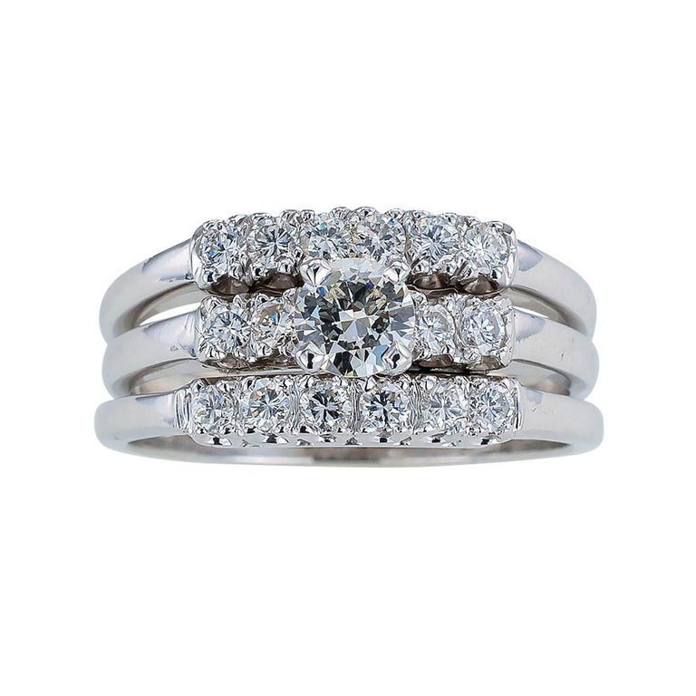Vintage three-ring diamond engagement ring set mounted in white gold circa 1950.   Love it because it caught your eye, and we are here to connect you with beautiful and affordable jewelry.  Simple and concise information you want to know is listed