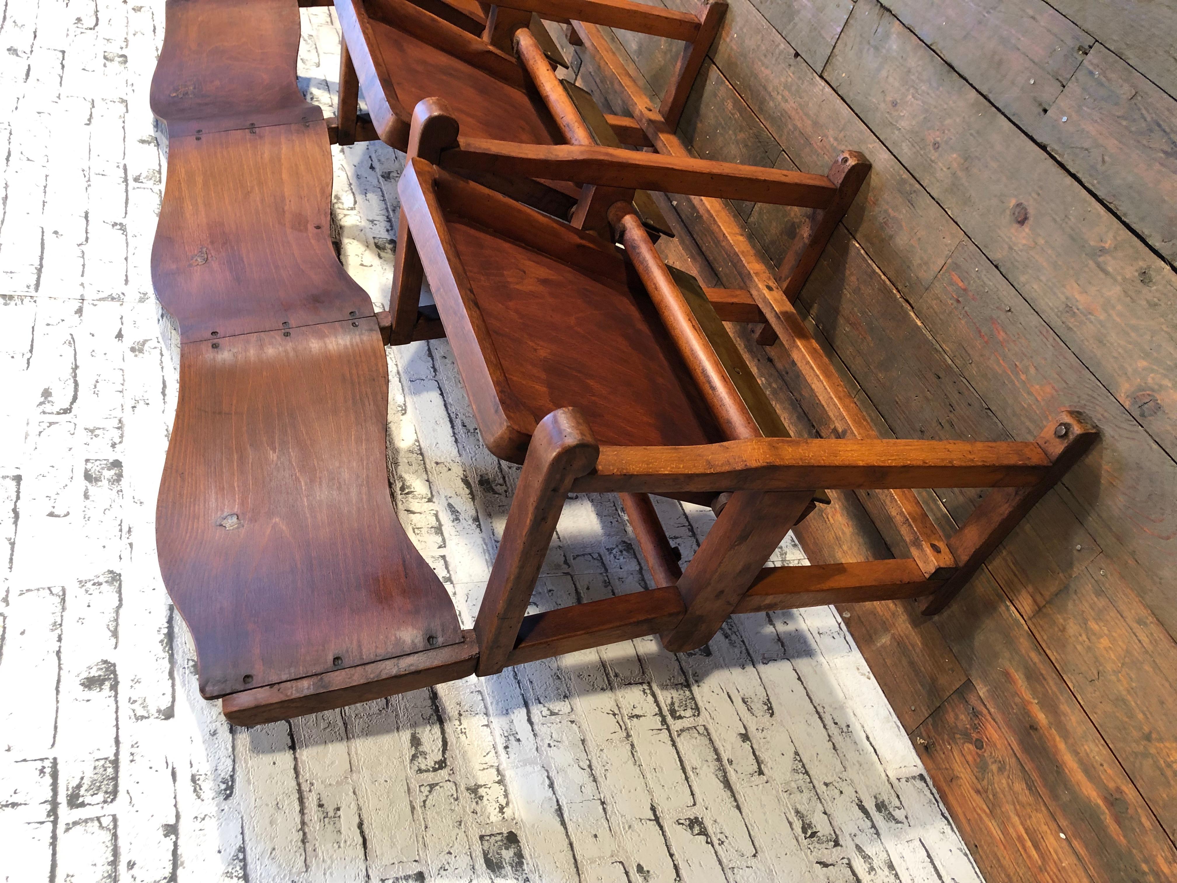 This three-seat cinema bench was produced in former Czechoslovakia during the 1930s. The chairs are stable and can be placed anywhere. It is completely made of wood (partly solid wood, partly plywood). The seats fold upwards. The weight of the bench