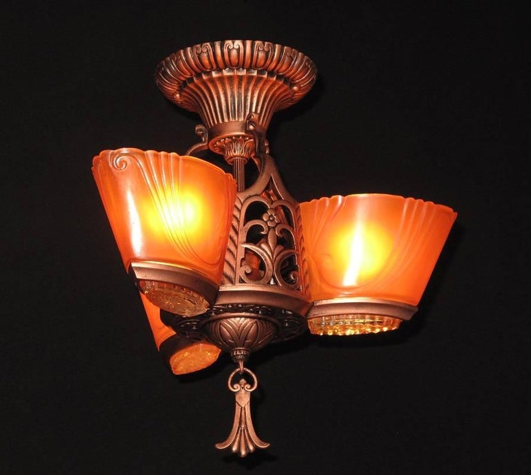 2 available priced each.
This antique lighting fixture is from the late 1920s to mid-1930s and was made by Virden of Milwaukee. Commonly referred to as the 