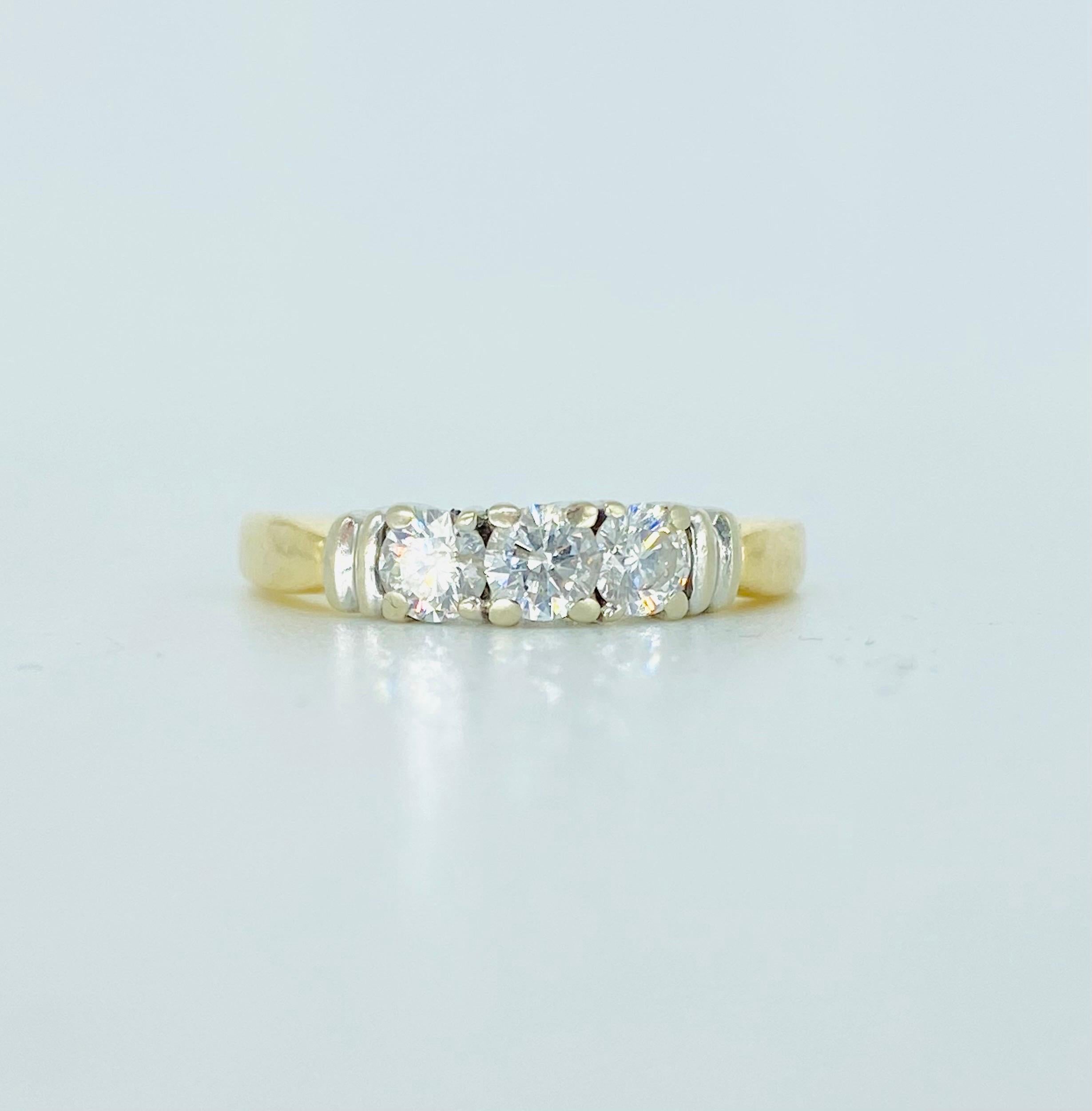 Vintage 3-Stone 0.60 Carat Diamond Ring 14k Gold. The ring features 3x round diamonds for a total of 0.60 carat. The diamonds are VS/SI clarity. The ring is a size 5.5 and weights 3.4 grams 14k gold.