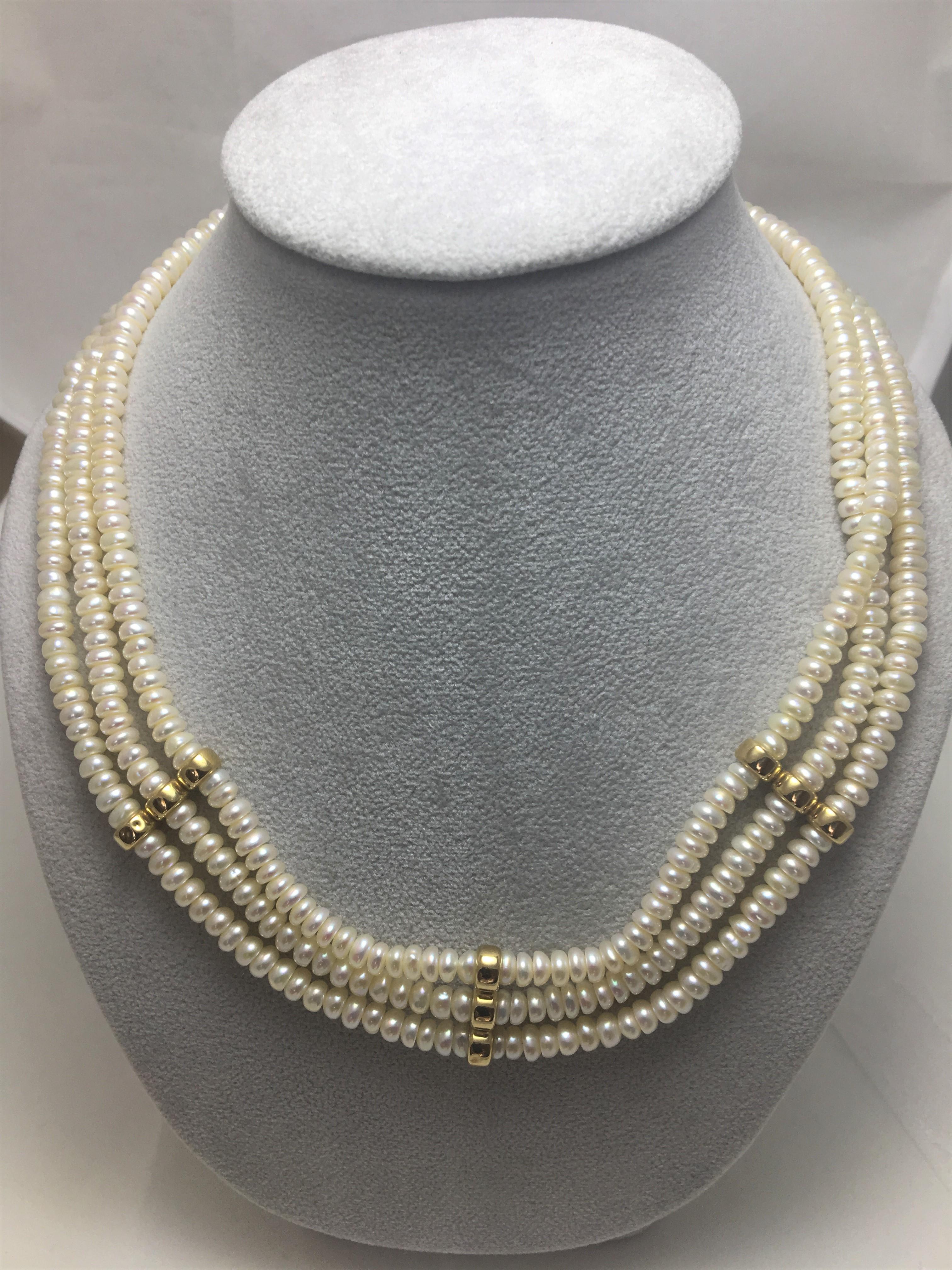 Raymond Mazza Designer
Three Strand Cream Colored Button Pearl Choker Necklace 
14 Karat Yellow Gold filigree clasp
Three 14 Karat Yellow Gold Stations that Hold Strands Together
Over 100 Cream Colored Fresh Water Pearls On Each Strand
Button Pearls