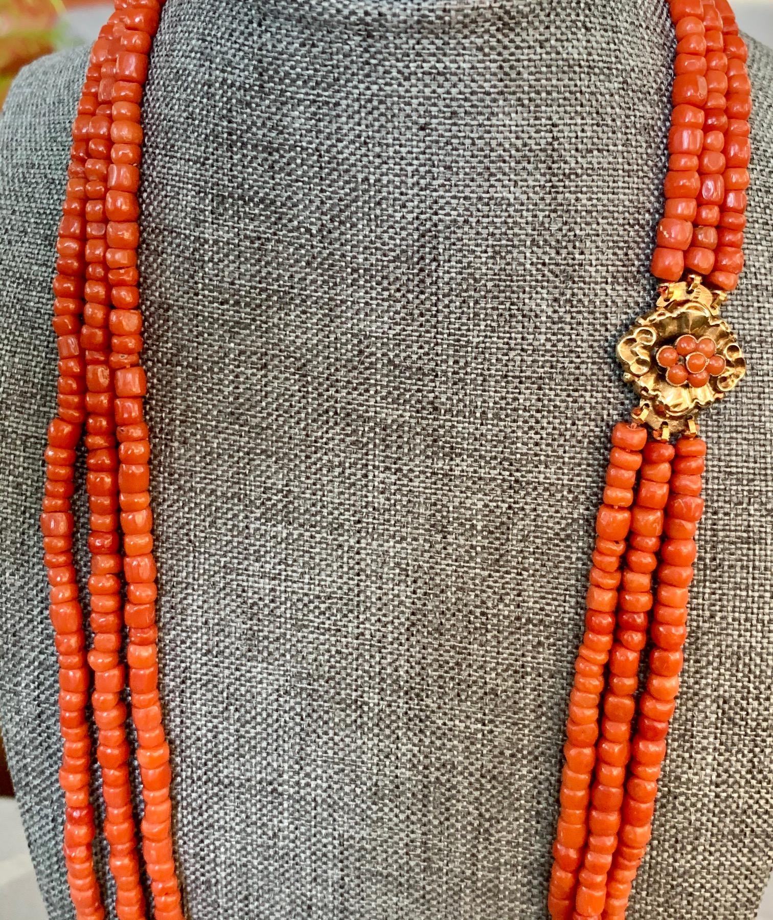 This lovely natural Coral three strand necklace features graduated beads ranging in size from 4 to 5mm.  The shortest strand is 25 inches and the longest strand is 28 inches.
Weight: 84.3 grams