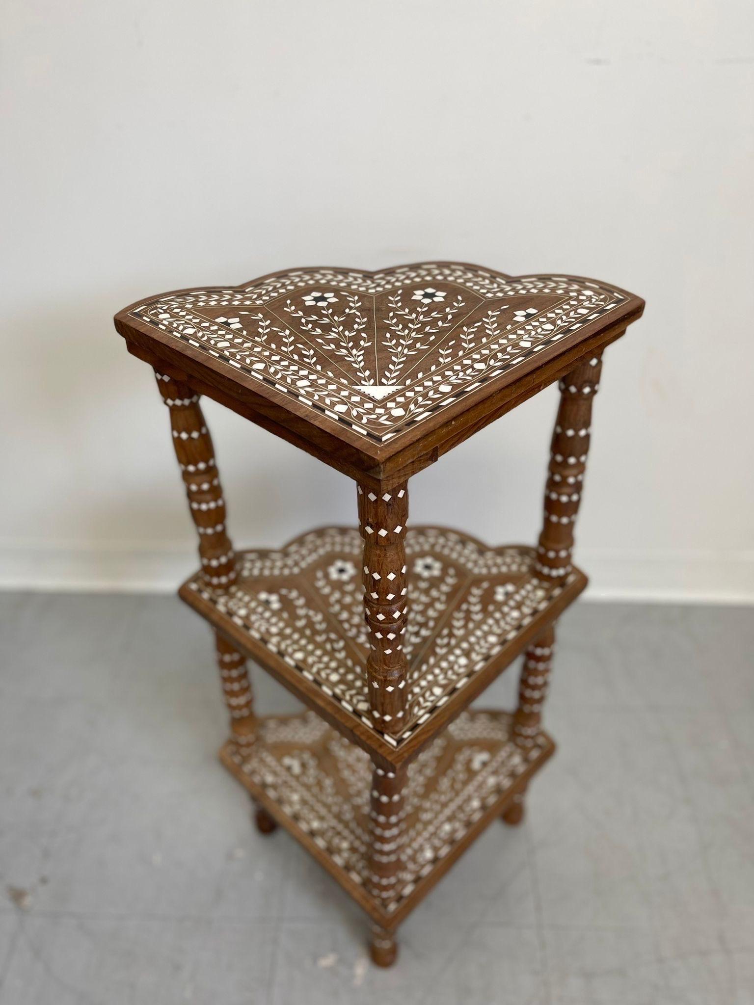 This Shelving unit Features a Bright White Floral Motif. Possibly She’ll Inlay , Possibly From India. Makers Mark and Serial Number are Pictured.

Dimensions. 11 1/2 W ; 11 D ; 28 H